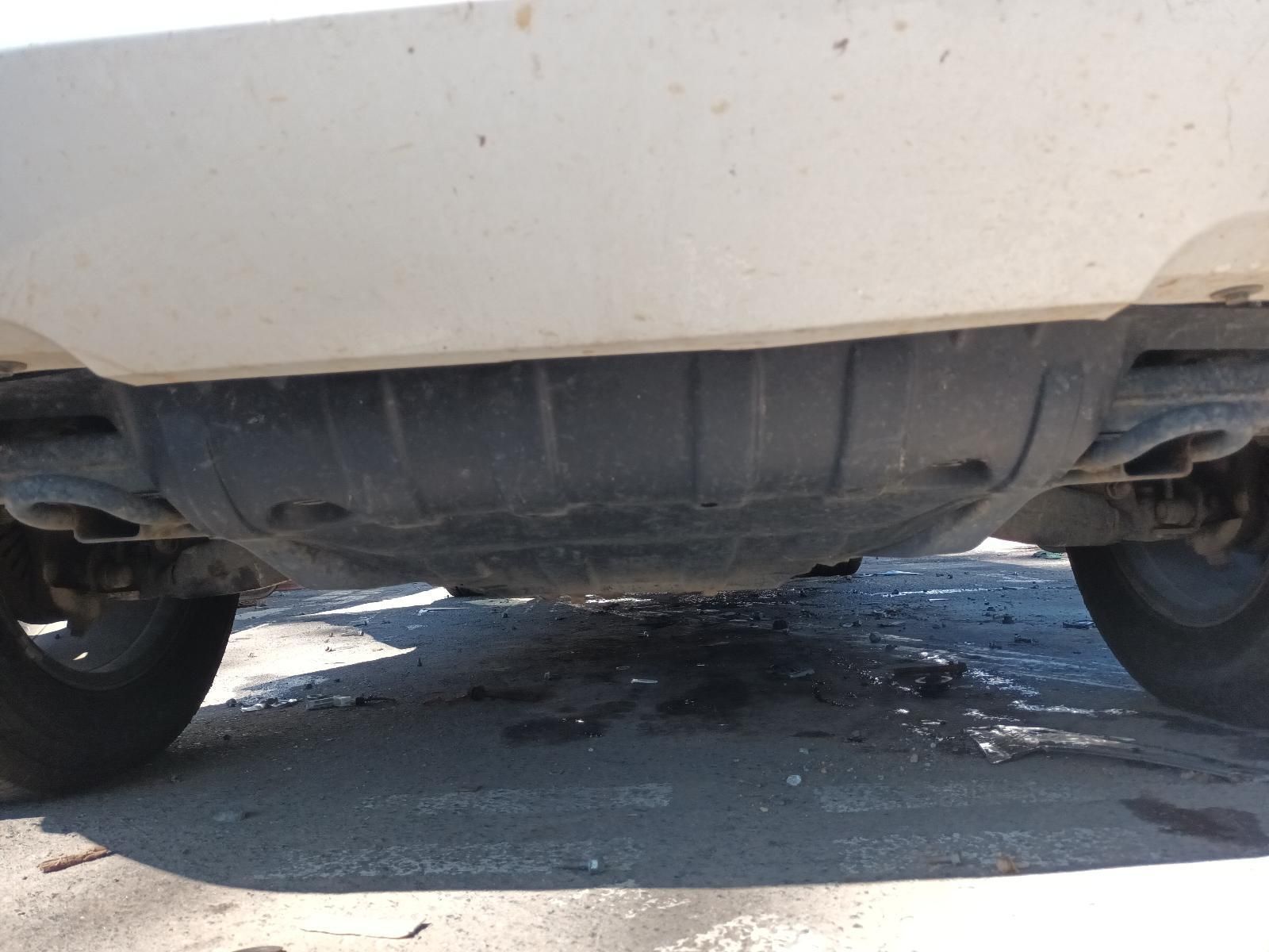 The Underside of a White Car is Shown — South West 4WD Wreckers in Harristown, QLD