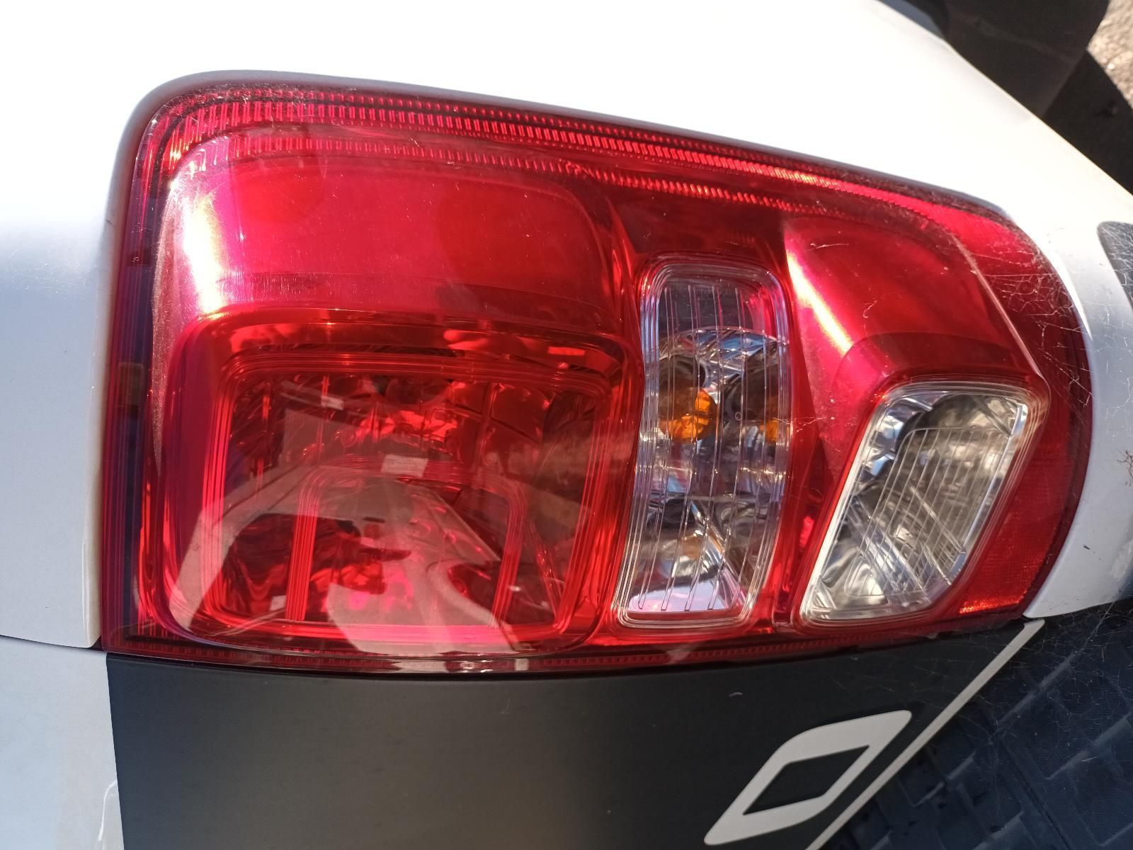 A Close Up of a Red Tail Light on a White Car — South West 4WD Wreckers in Harristown, QLD