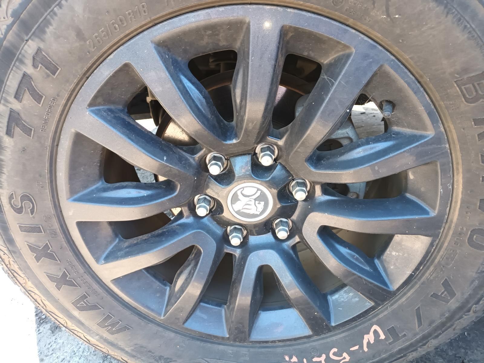 A Close Up of a Black Tire with the Word Maxxis on It — South West 4WD Wreckers in Harristown, QLD