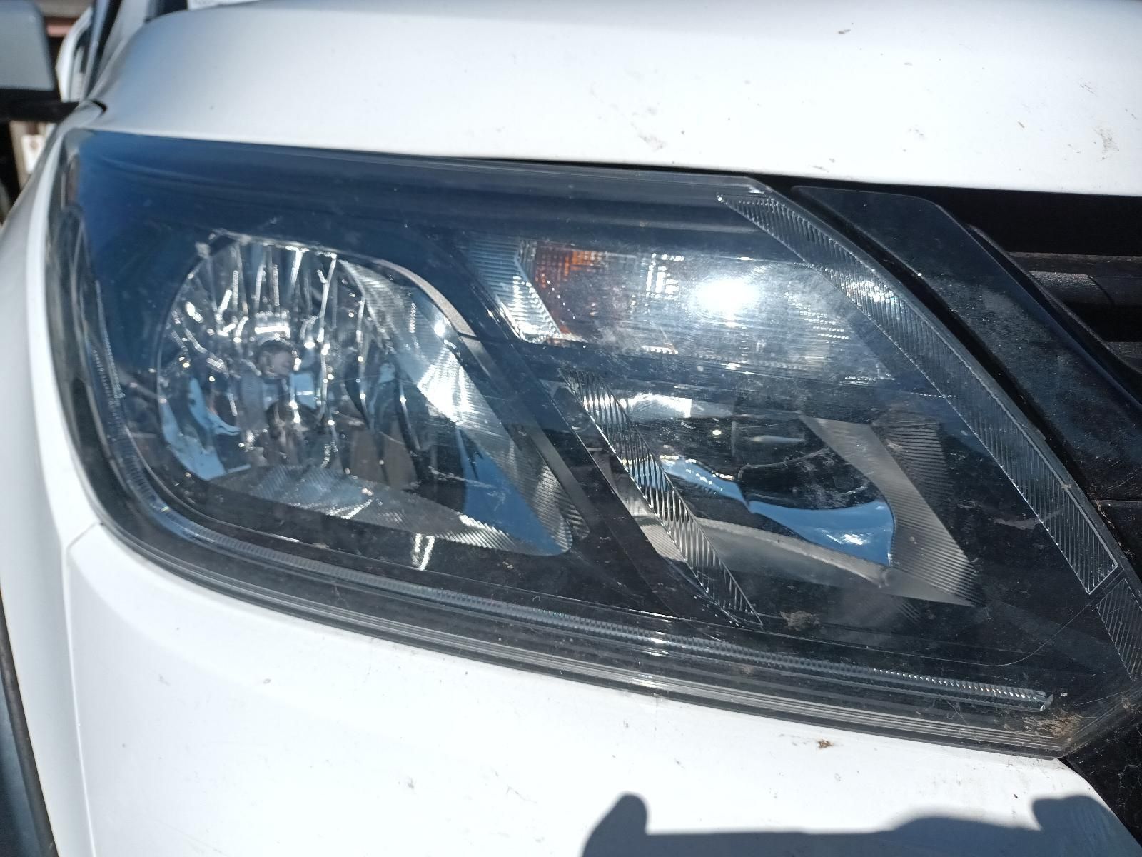A Close Up of a White Car's Headlight — South West 4WD Wreckers in Harristown, QLD