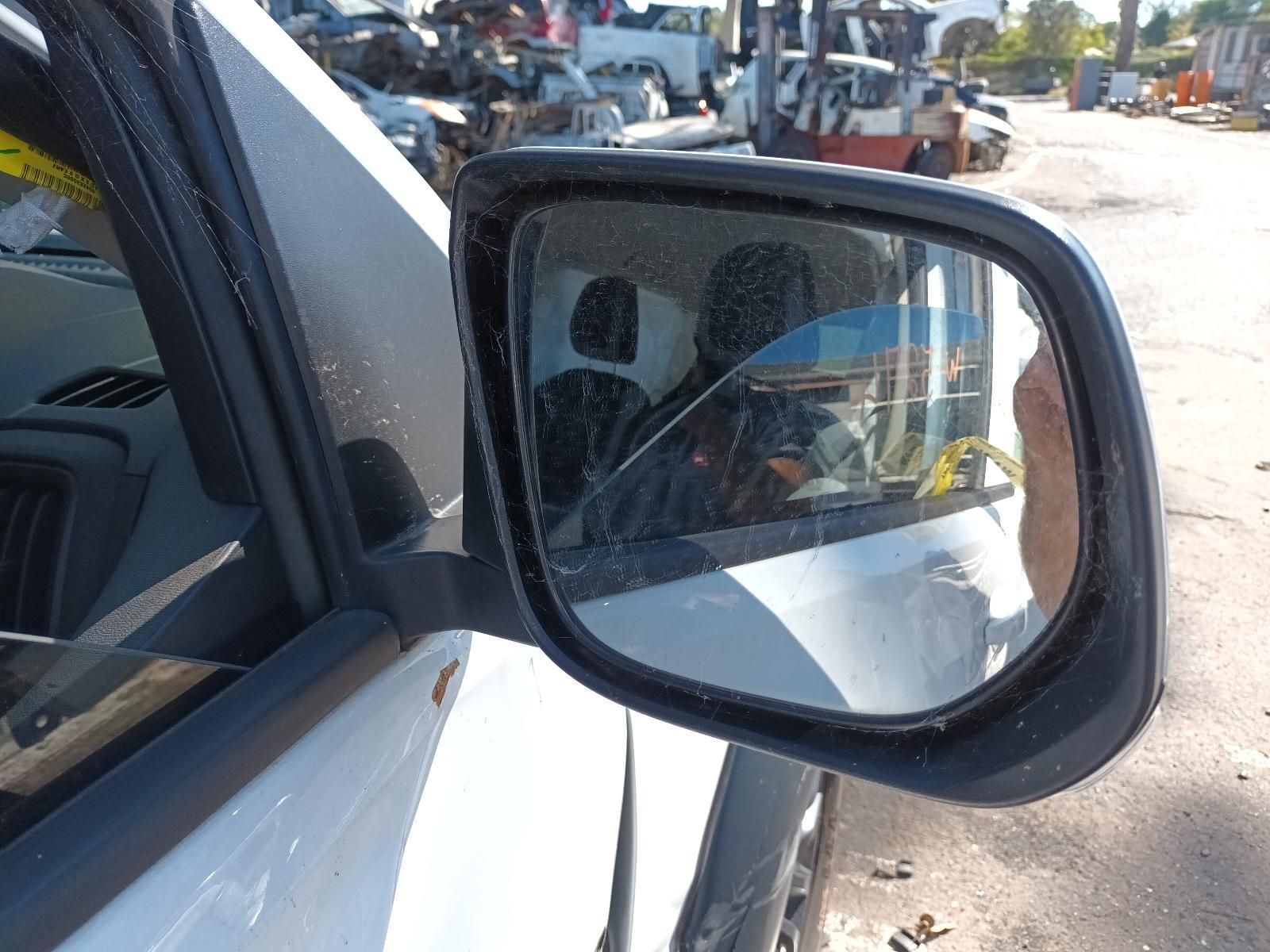 A Close Up of a Side View Mirror on a White Car — South West 4WD Wreckers in Harristown, QLD
