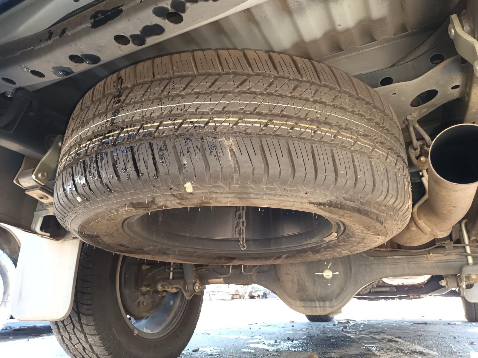 A Car with a Spare Tire Underneath It — South West 4WD Wreckers in Harristown, QLD