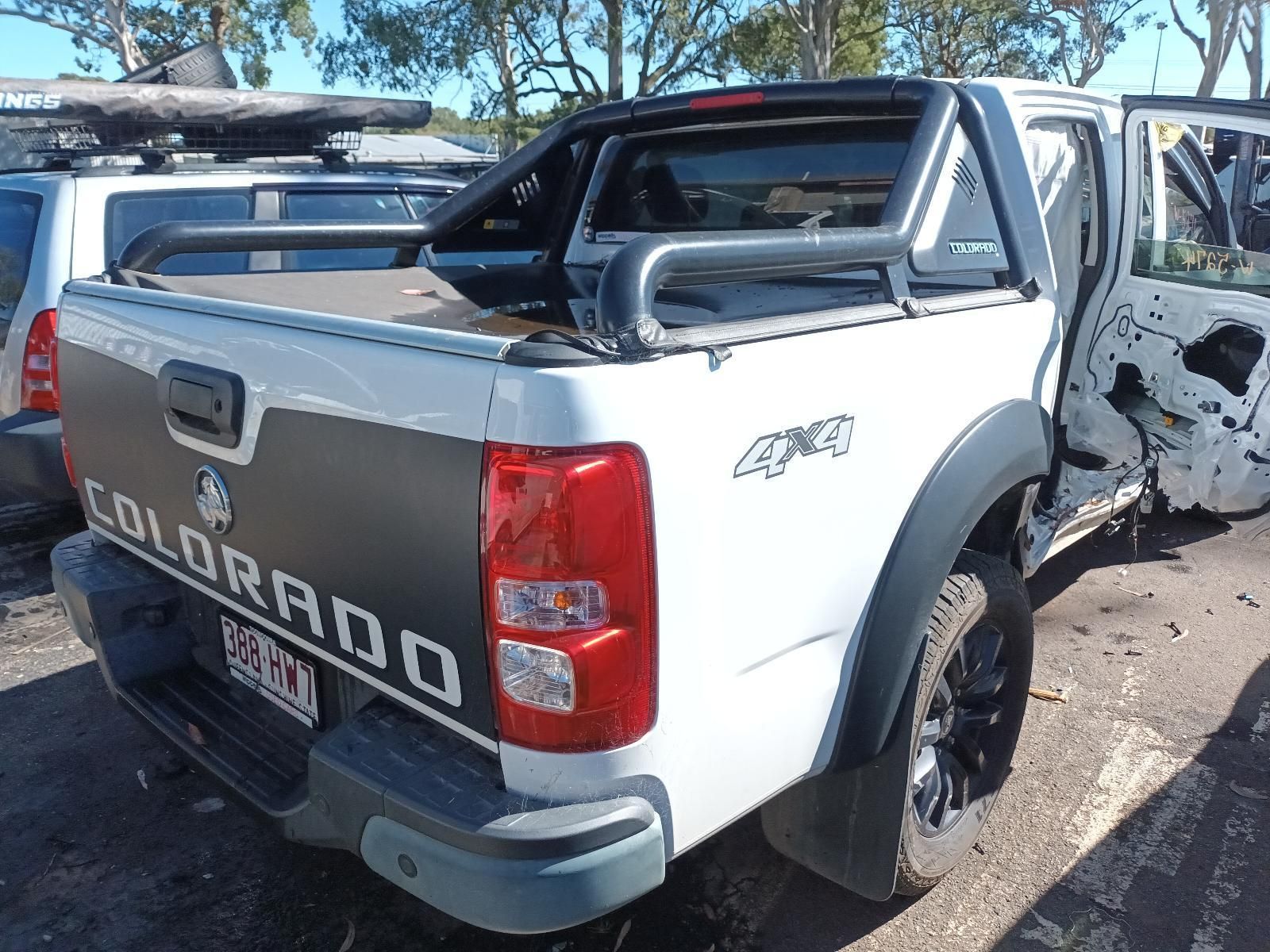 A White Colorado Truck is Parked in a Parking Lot — South West 4WD Wreckers in Harristown, QLD