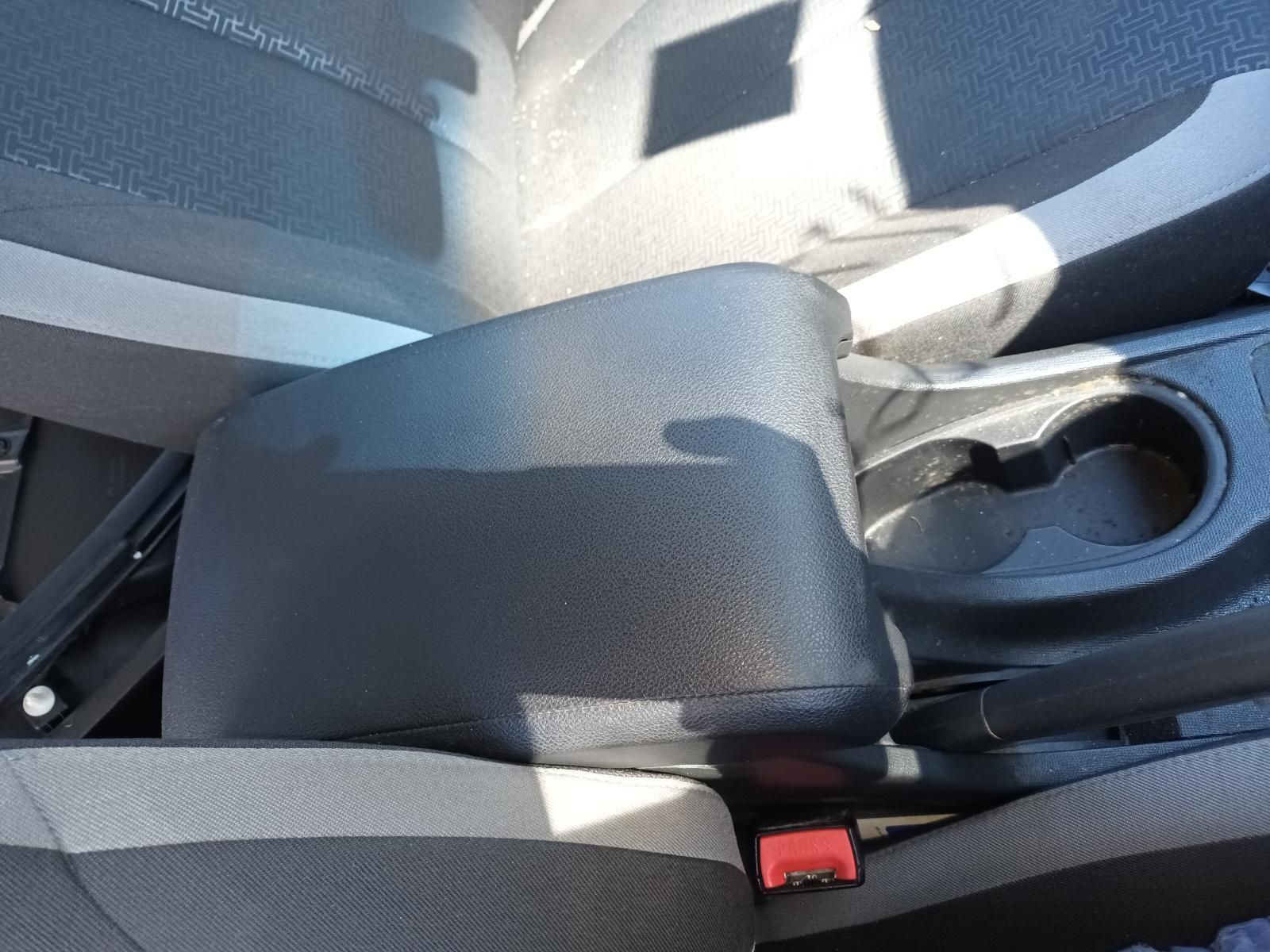 A Black Arm Rest in a Car with a Cup Holder — South West 4WD Wreckers in Harristown, QLD