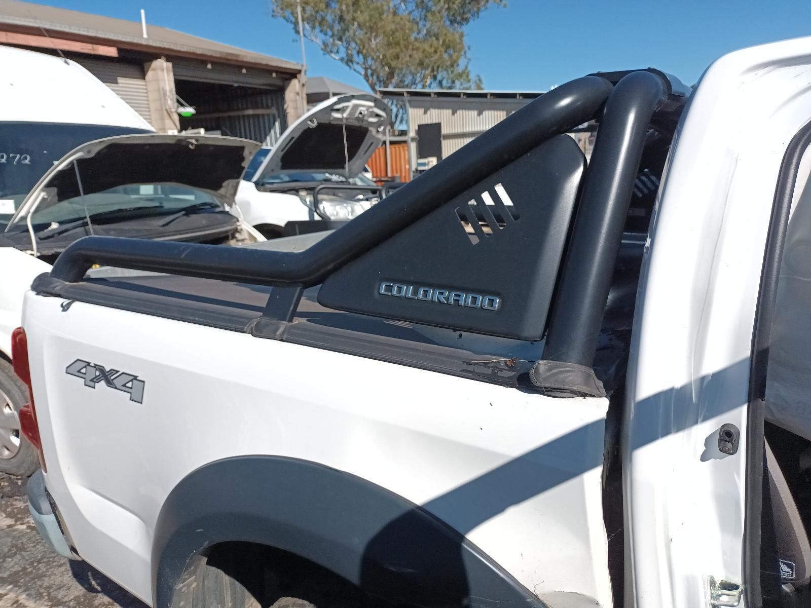 A White Truck with a Black Bar on the Back of It — South West 4WD Wreckers in Harristown, QLD