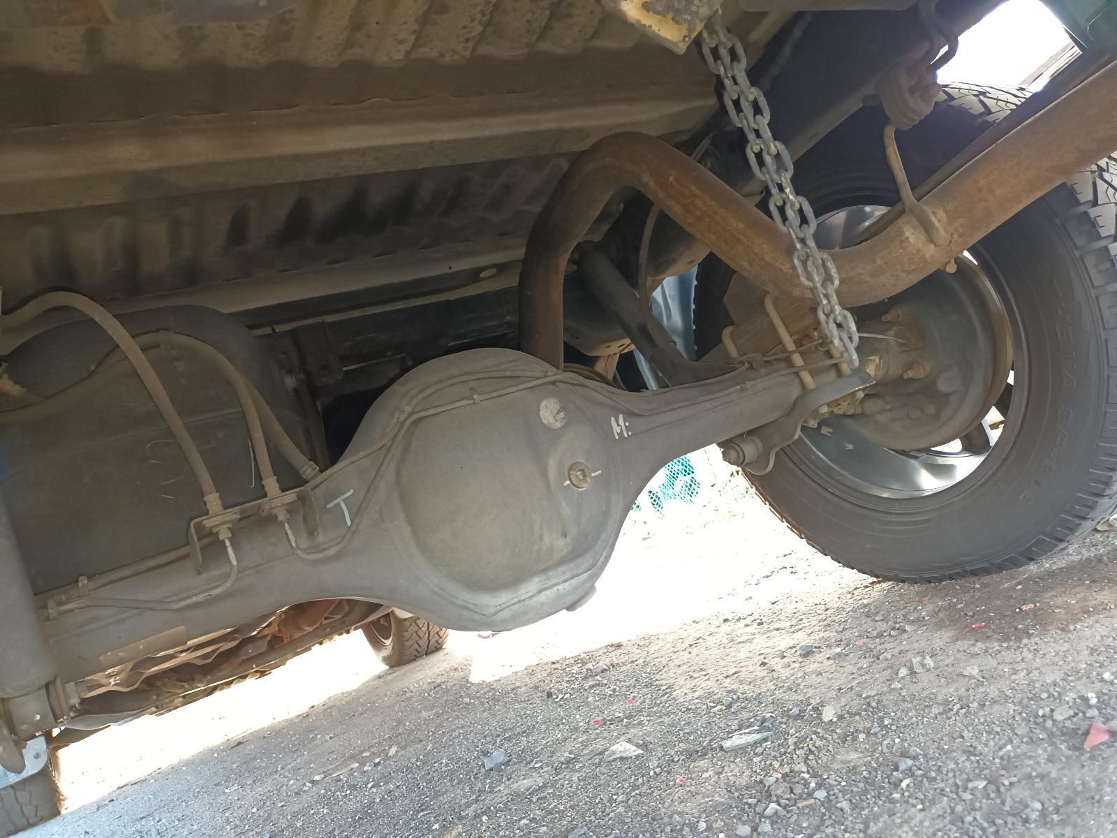 The Rear Axle of a Truck is Hanging From a Chain — South West 4WD Wreckers In Harristown, QLD
