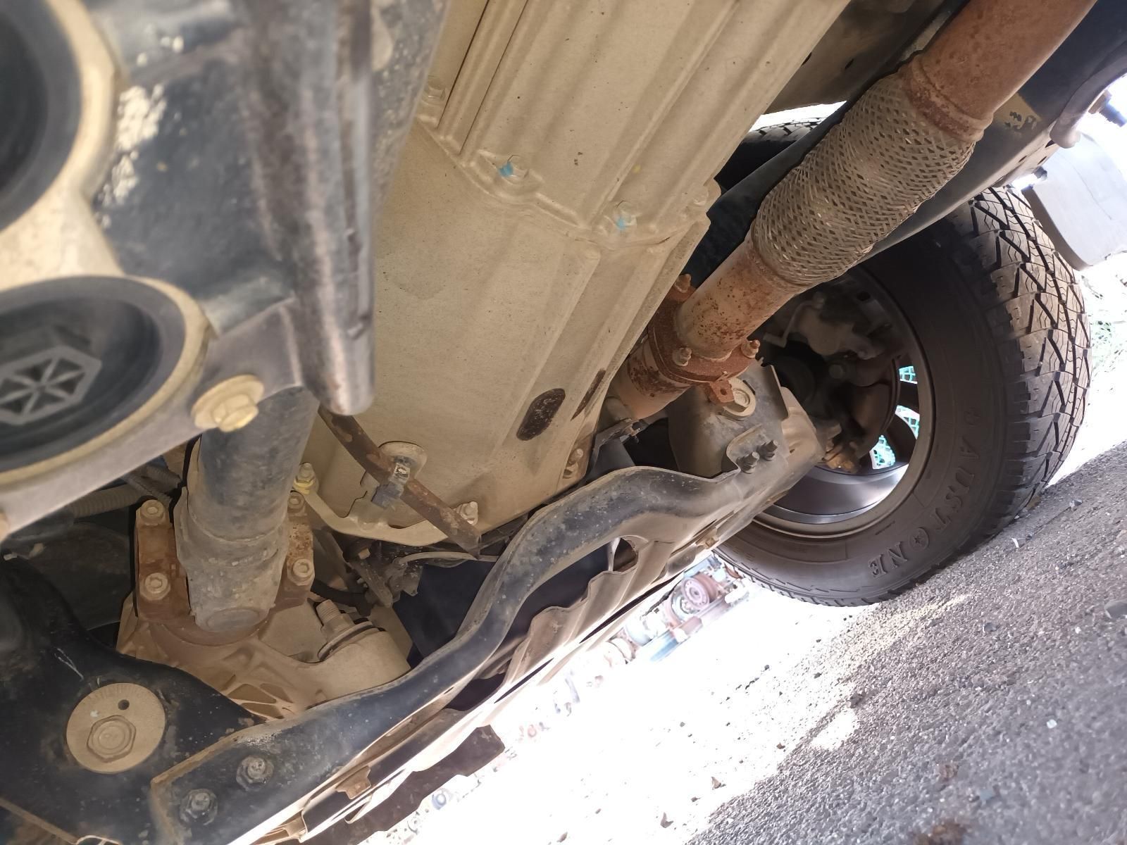 A Close Up of the Underside of a Car Showing the Exhaust Pipe — South West 4WD Wreckers In Harristown, QLD