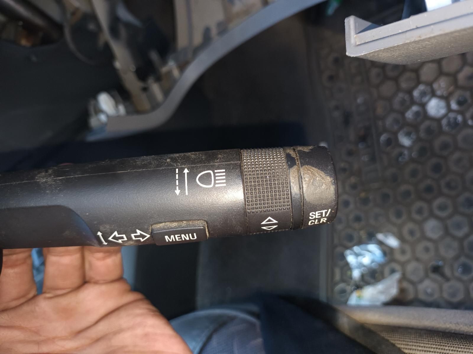 A Person is Holding a Steering Wheel Control in Their Hand — South West 4WD Wreckers In Harristown, QLD 