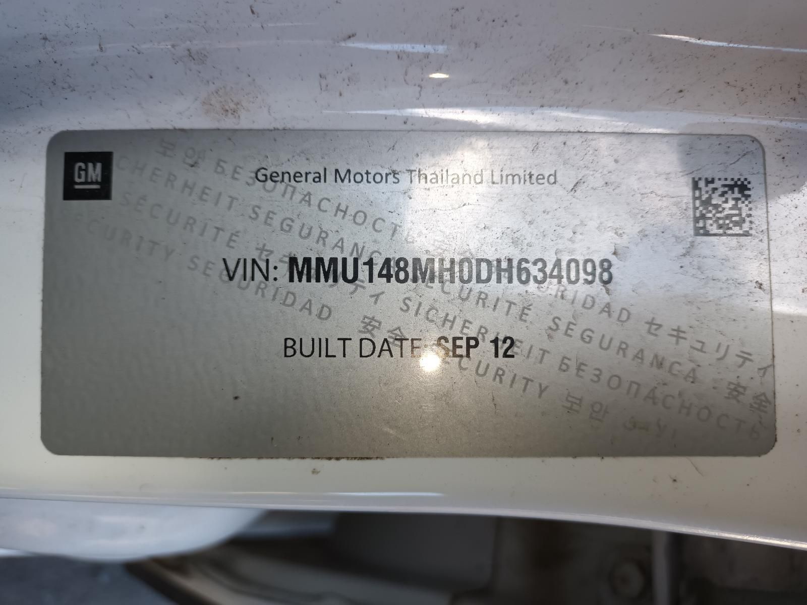 A White Gm Car With a License Plate That Says Mmu148mh0dh634098 — South West 4WD Wreckers In Harristown, QLD