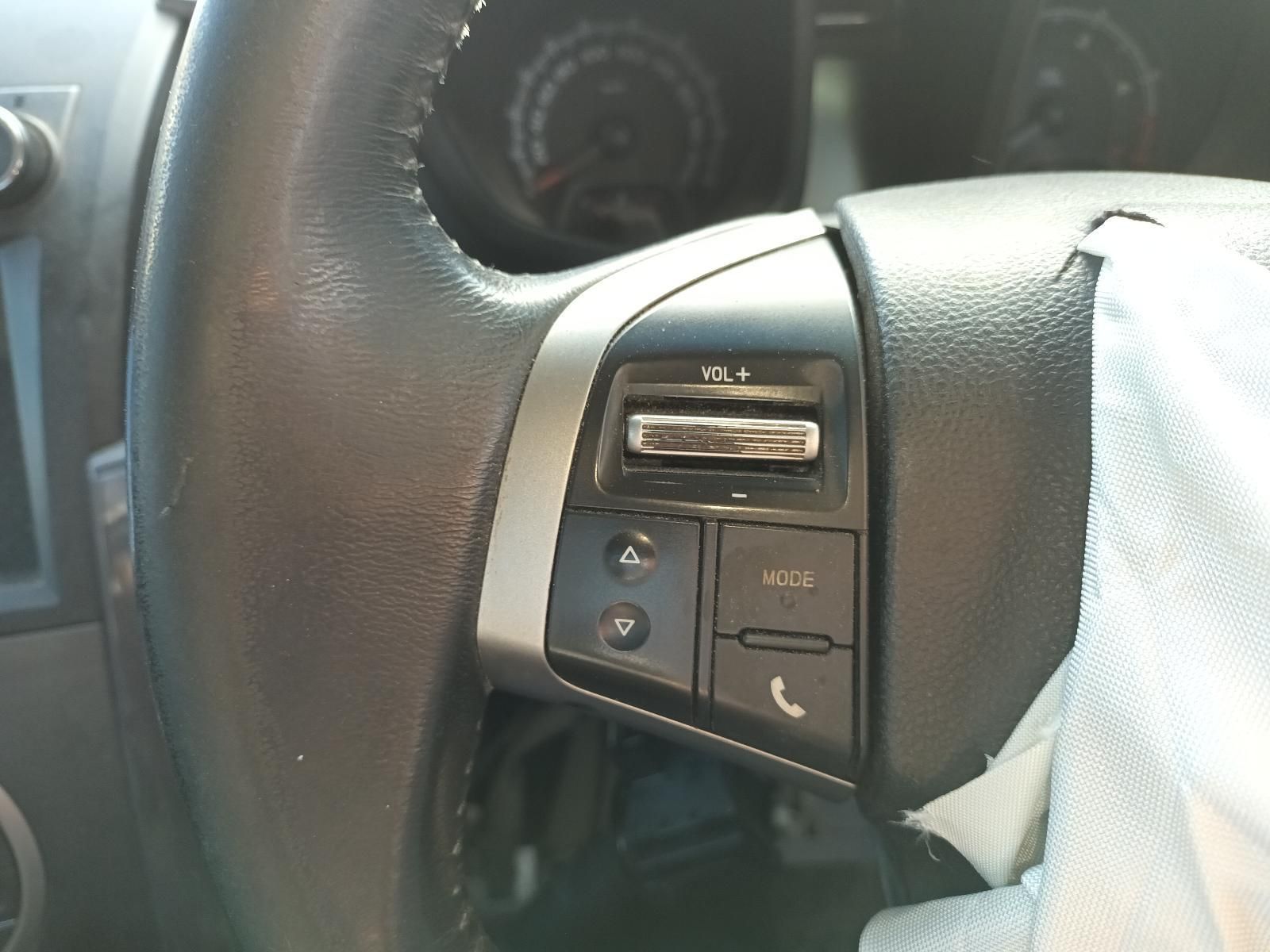 A Close Up of a Car Steering Wheel With a Phone Button — South West 4WD Wreckers In Harristown, QLD