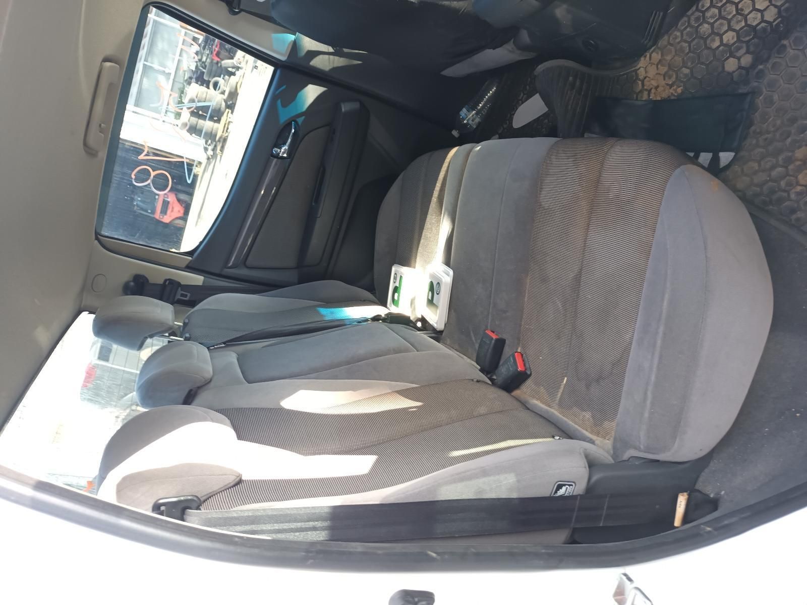 A White Car With a Gray Seat and a Mirror — South West 4WD Wreckers In Harristown, QLD