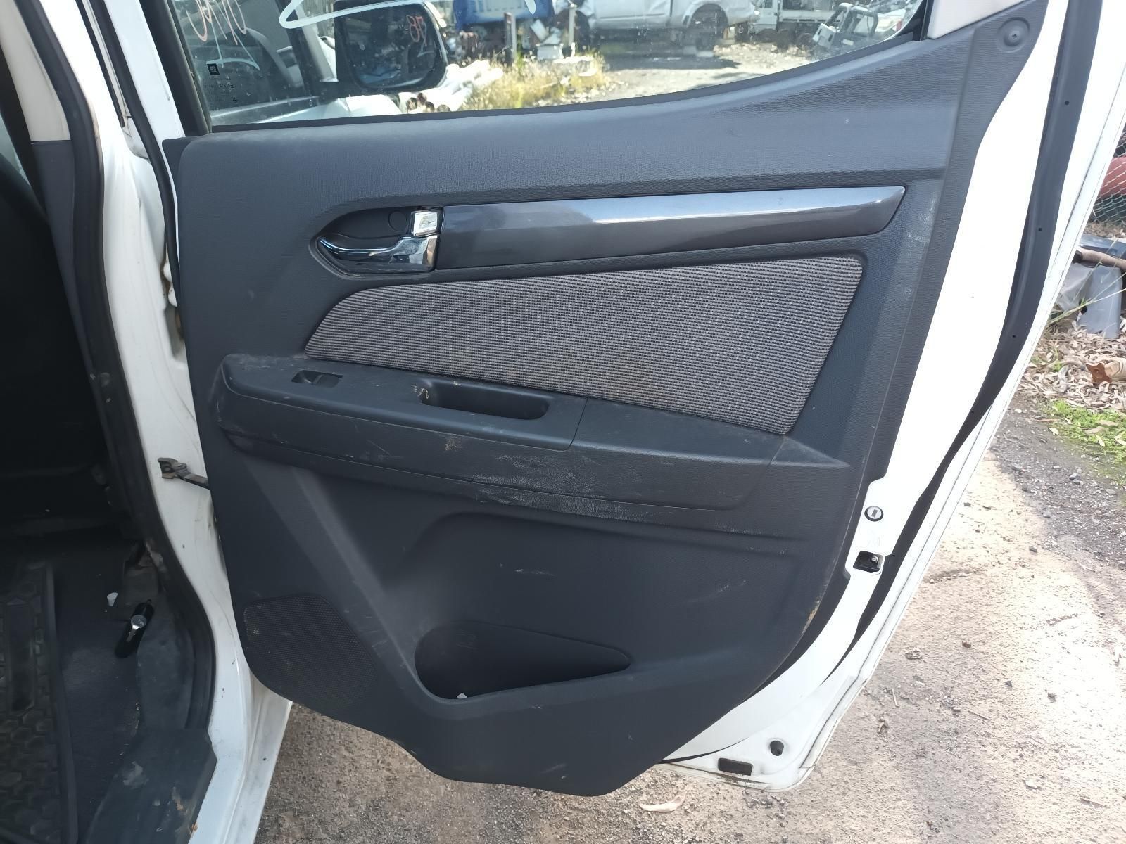 The Door of a White Car is Open and Sitting on the Ground — South West 4WD Wreckers In Harristown, QLD