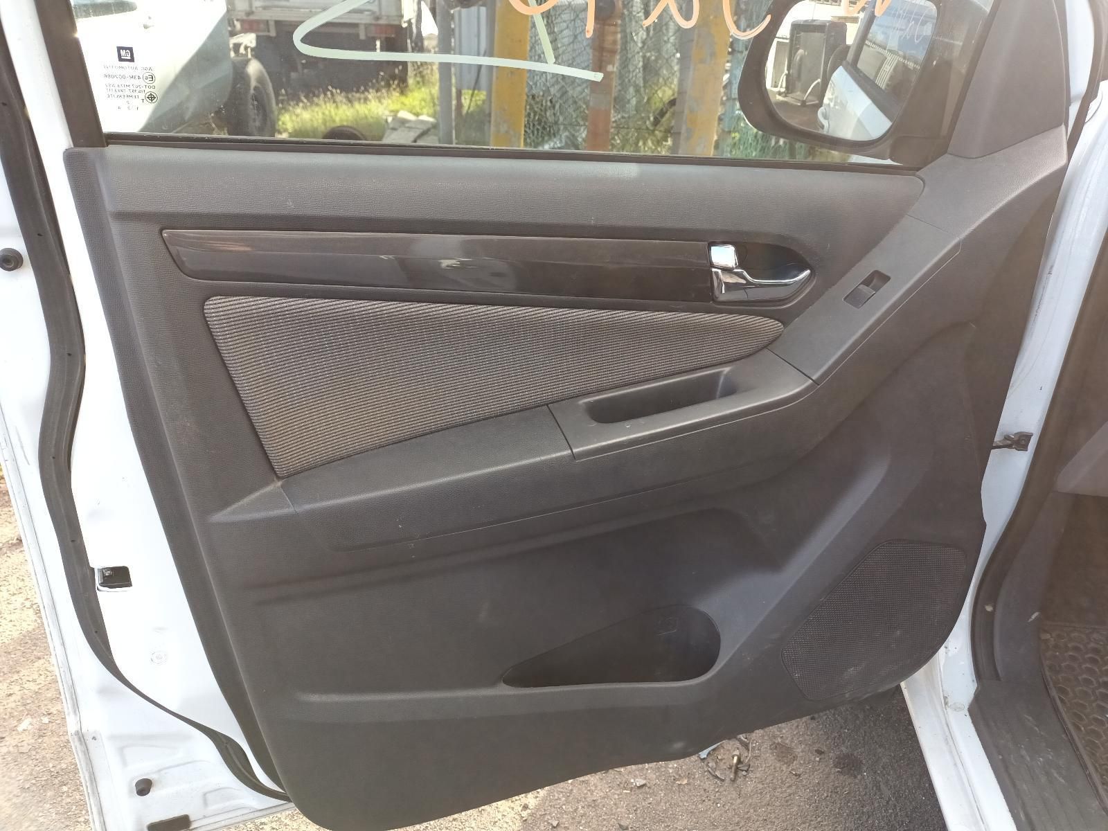 A White Car With the Door Open is Parked on the Side of the Road — South West 4WD Wreckers In Harristown, QLD