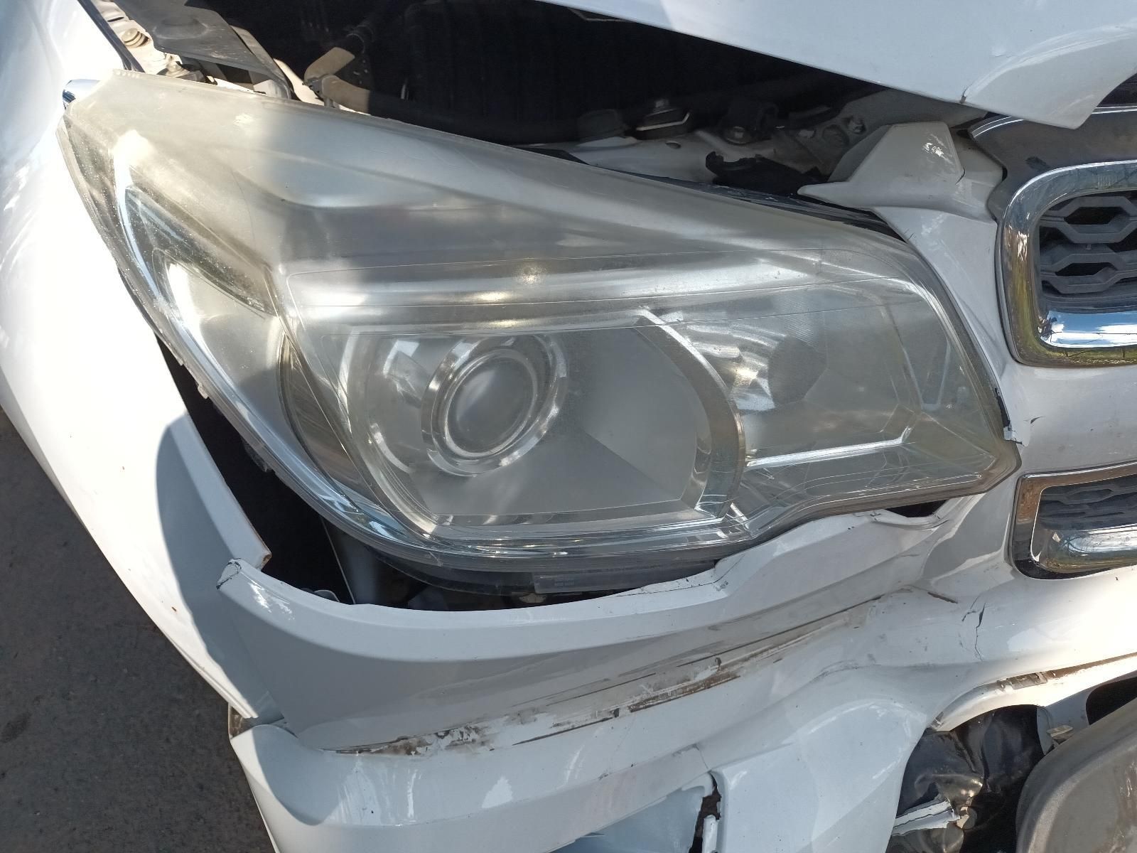 A Close Up of a White Car With a Broken Headlight — South West 4WD Wreckers In Harristown, QLD