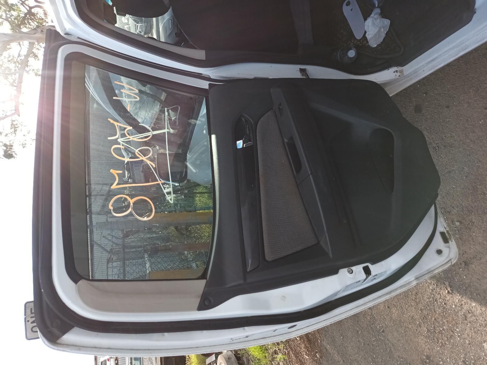 The Back Door of a White Car With the Door Open — South West 4WD Wreckers In Harristown, QLD