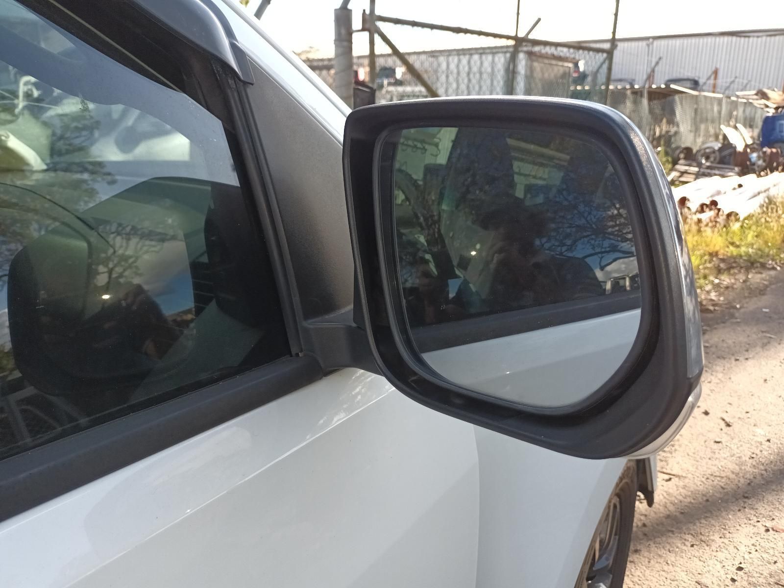 A Close Up of a Side View Mirror on a White Car — South West 4WD Wreckers In Harristown, QLD