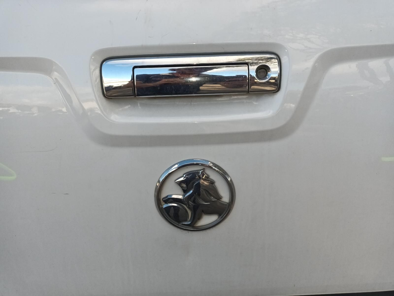 A White Car With a Horse Emblem on the Back — South West 4WD Wreckers In Harristown, QLD