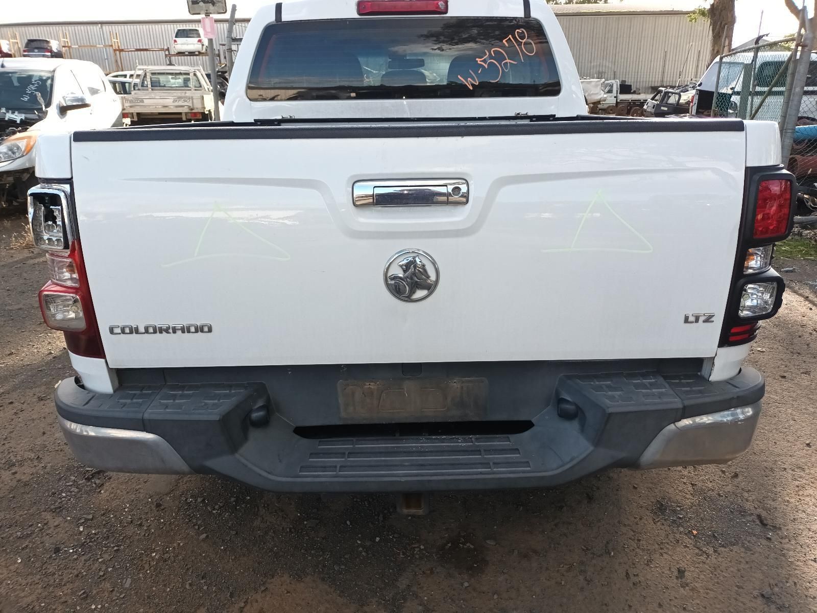 The Back End of a White Pickup Truck is Shown — South West 4WD Wreckers In Harristown, QLD