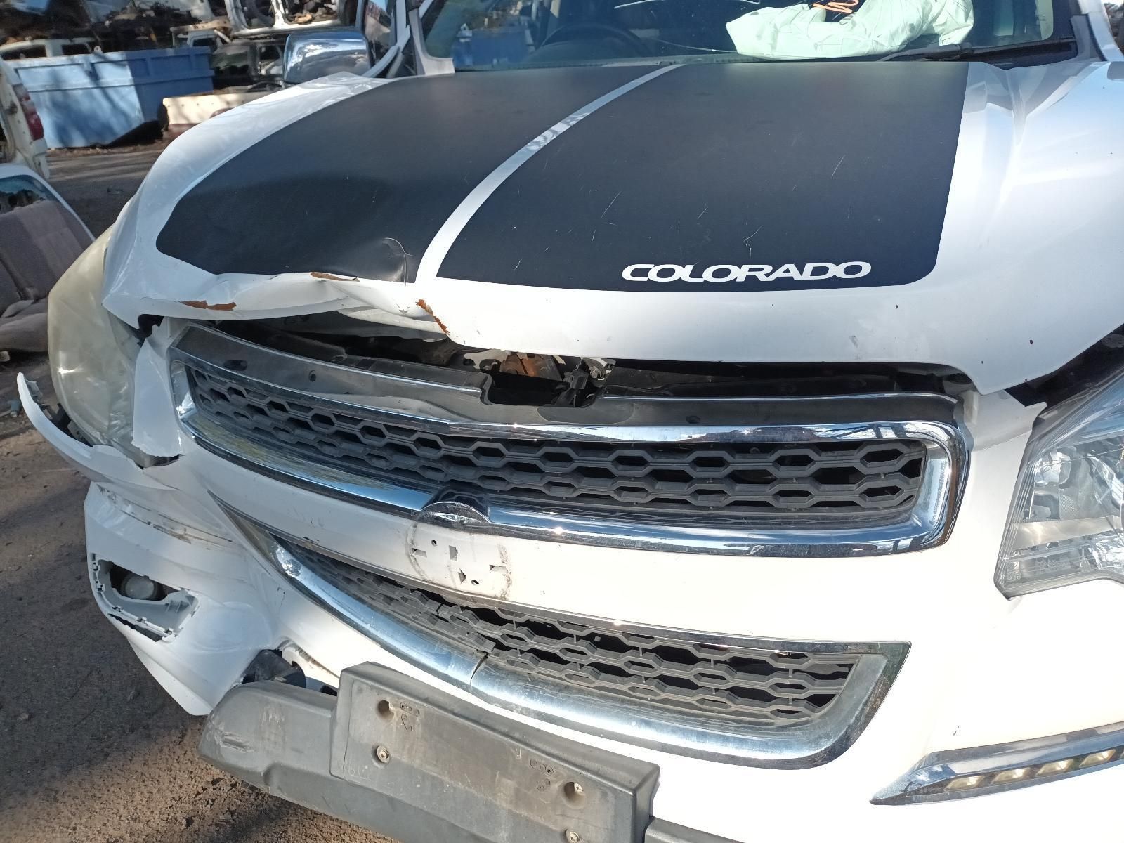 A White Chevrolet Colorado With a Black Hood Stripe — South West 4WD Wreckers In Harristown, QLD