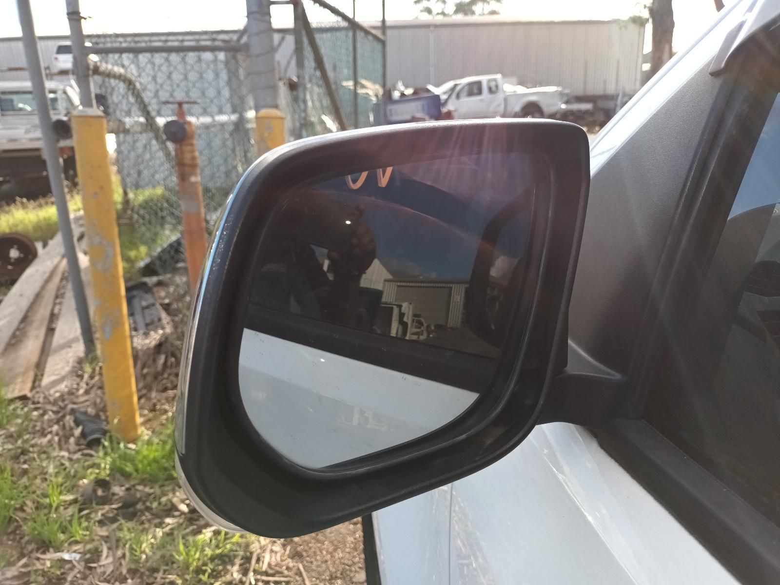 A Close Up of a Side View Mirror on a White Car — South West 4WD Wreckers In Harristown, QLD