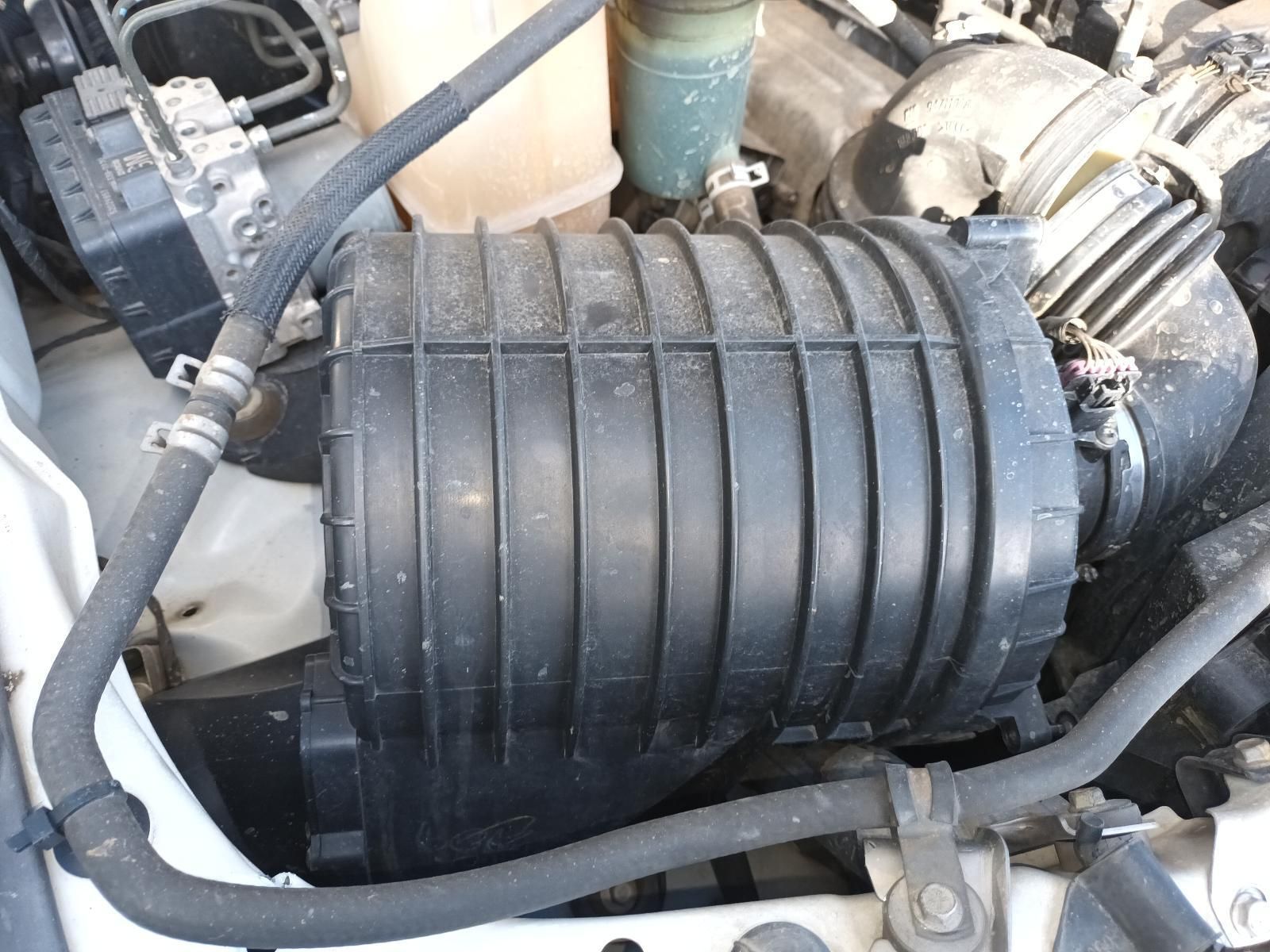 A Close Up of a Car Engine With a Black Air Filter — South West 4WD Wreckers In Harristown, QLD
