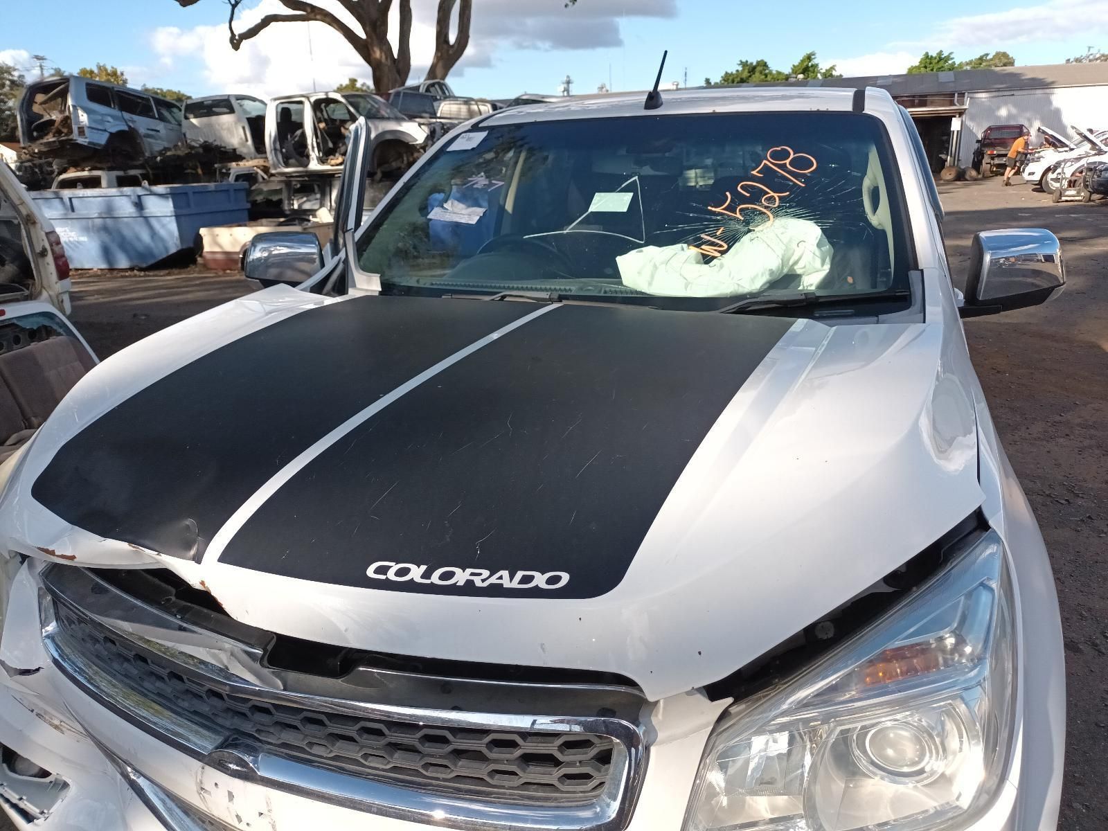 A White Colorado Truck With a Black Stripe on the Hood — South West 4WD Wreckers In Harristown, QLD