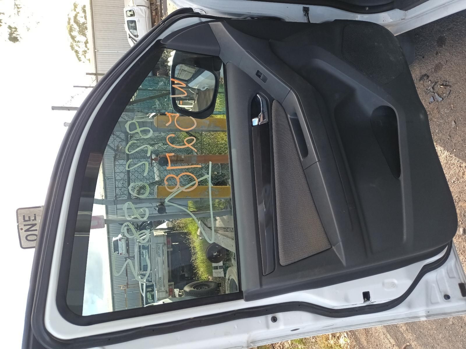 A White Car With the Door Open is Parked on the Side of the Road — South West 4WD Wreckers In Harristown, QLD