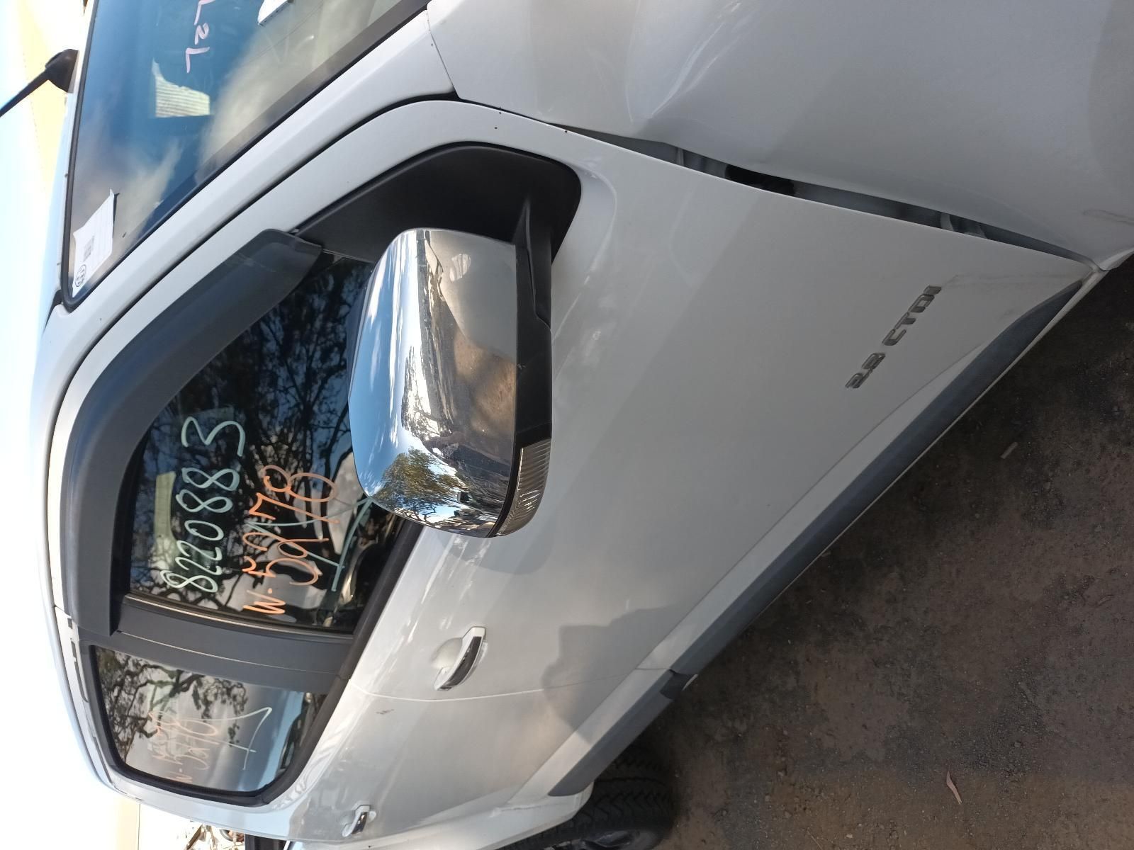 A White Truck With a Sticker on the Door That Says S5083 — South West 4WD Wreckers In Harristown, QLD