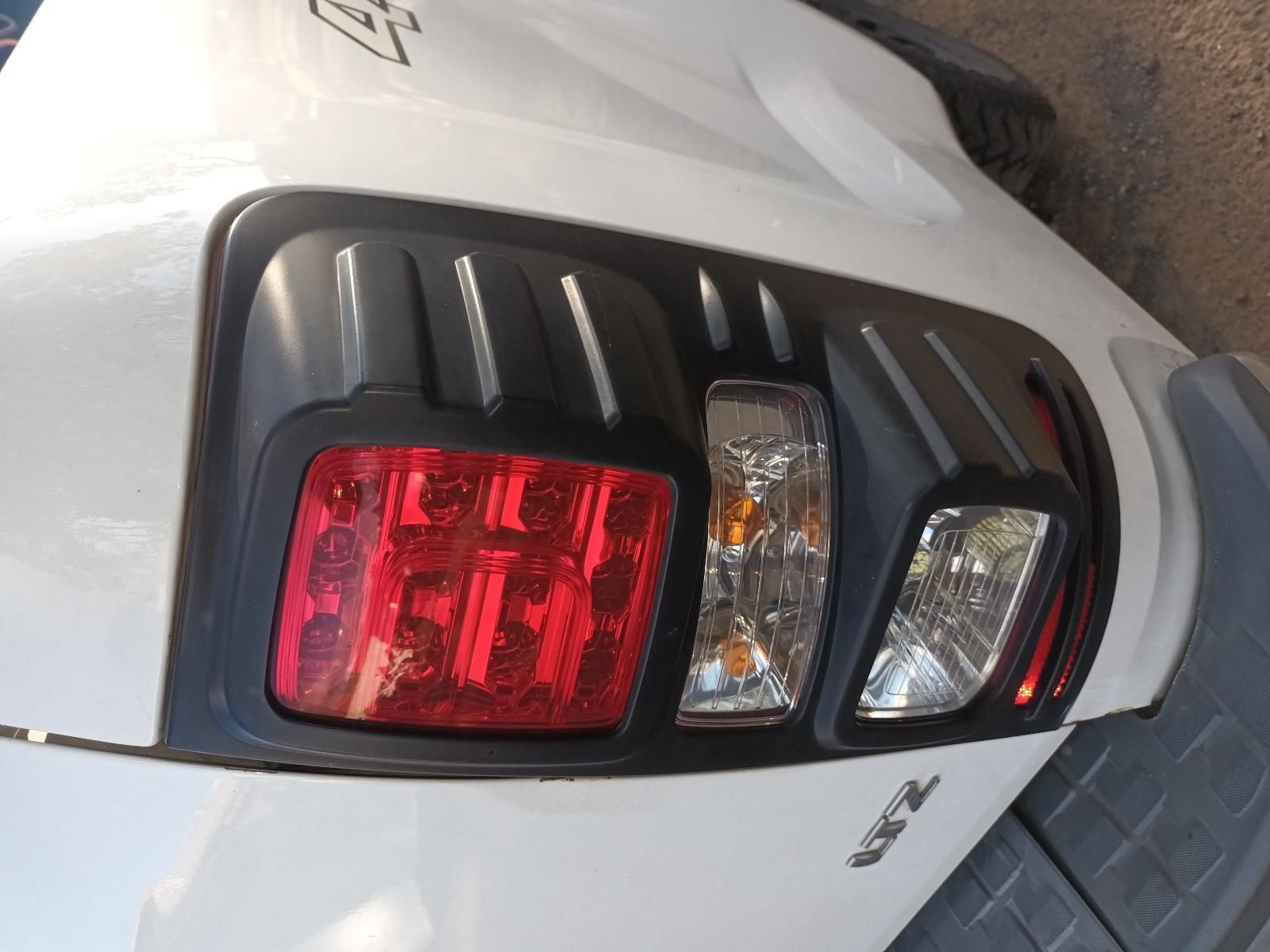 A Close Up of a White Car 's Tail Light — South West 4WD Wreckers In Harristown, QLD