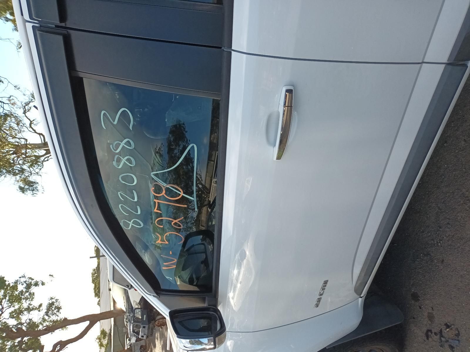 A White Car is Parked on the Side of the Road — South West 4WD Wreckers In Harristown, QLD