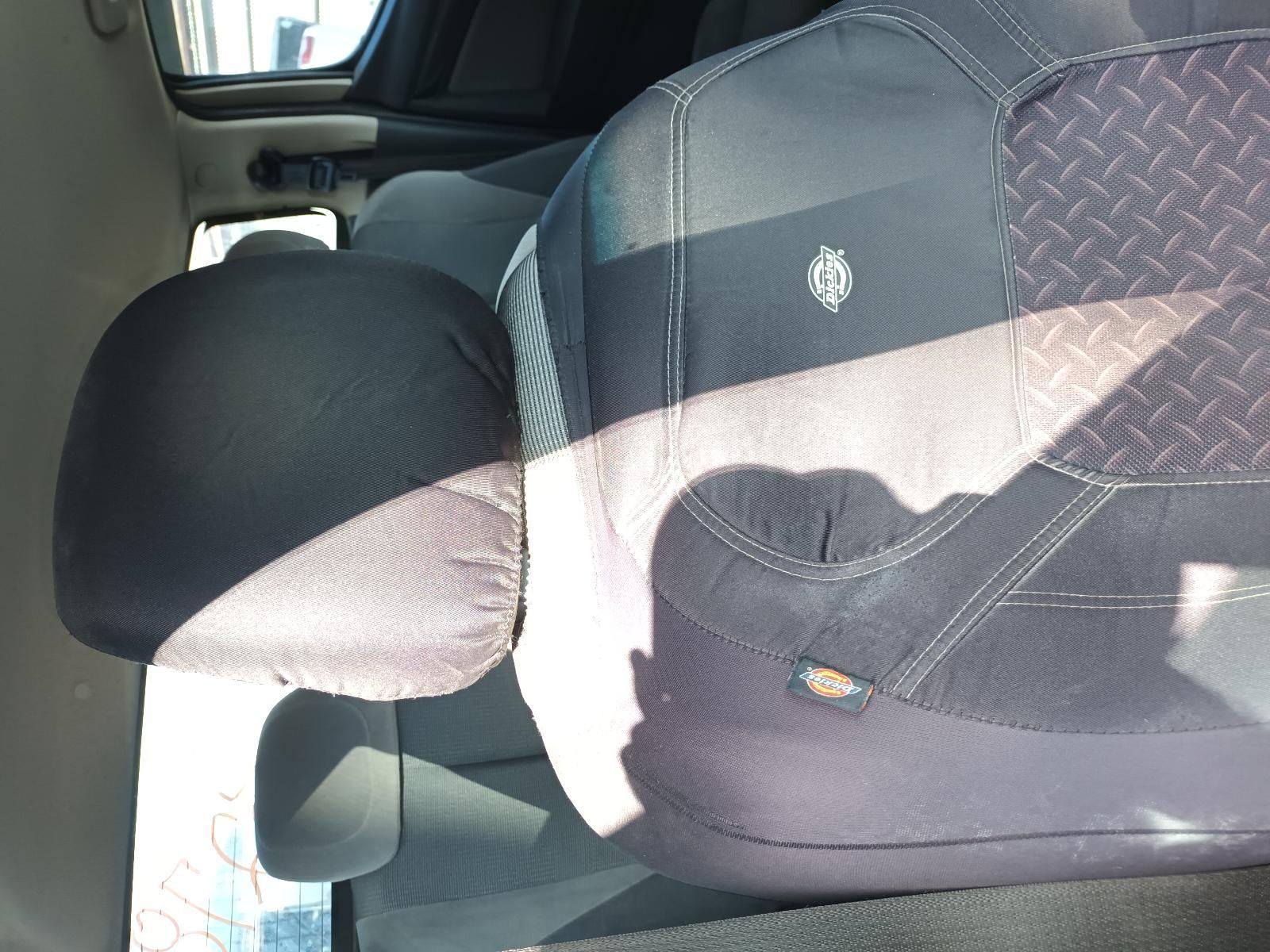 A Person is Sitting in the Back Seat of a Car — South West 4WD Wreckers In Harristown, QLD