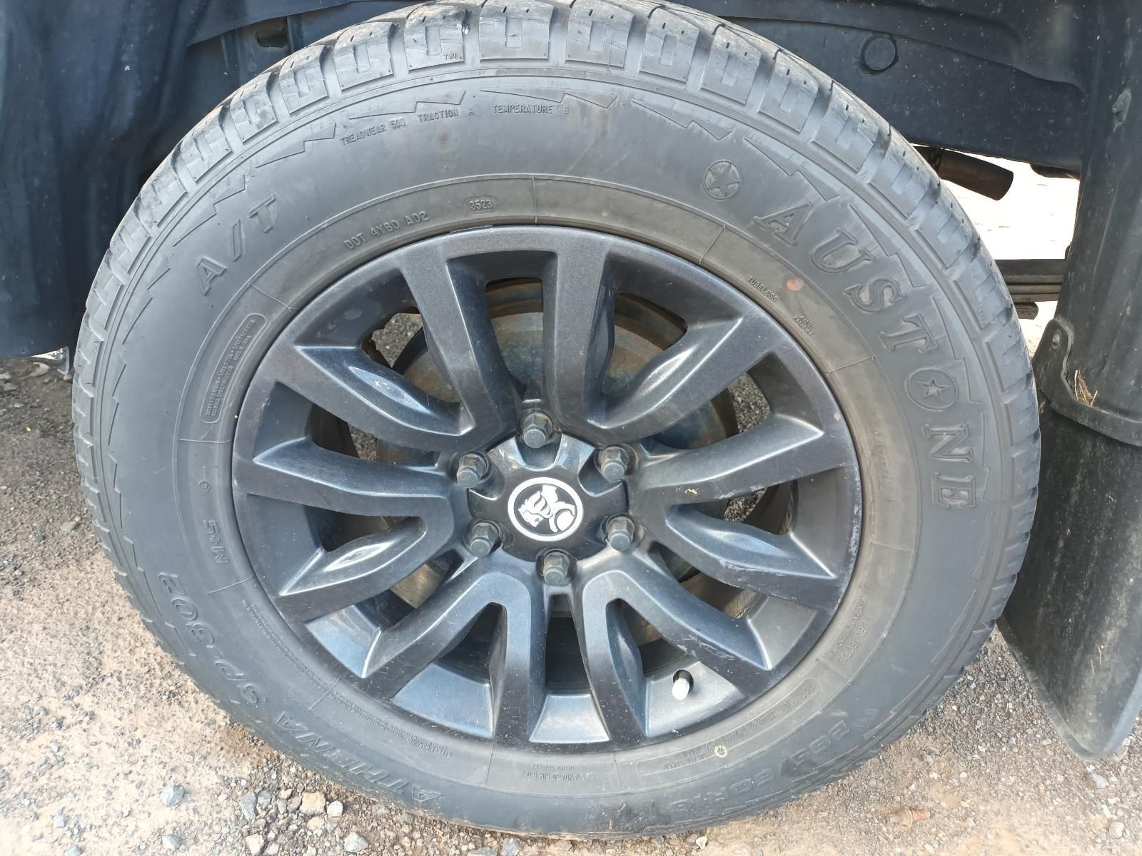 A Close Up of a Tire on a Car With Black Wheels — South West 4WD Wreckers In Harristown, QLD