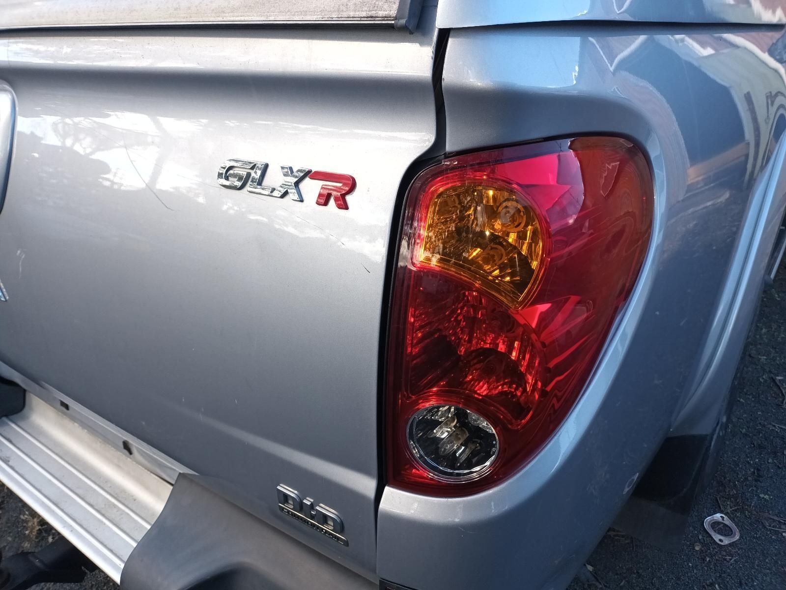 The Back End of a Silver Truck — South West 4WD Wreckers in Harristown, QLD