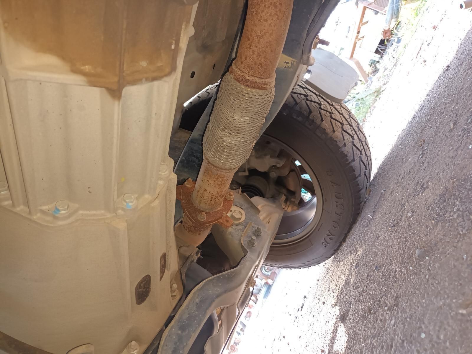 A Close Up of the Underside of a Car with a Rusty Exhaust Pipe — South West 4WD Wreckers in Harristown, QLD