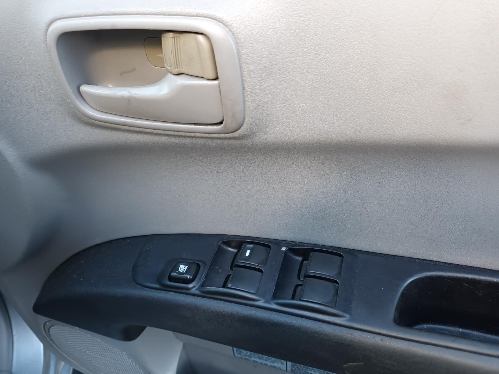 A Close Up of a Car Door with a Window Switch — South West 4WD Wreckers in Harristown, QLD