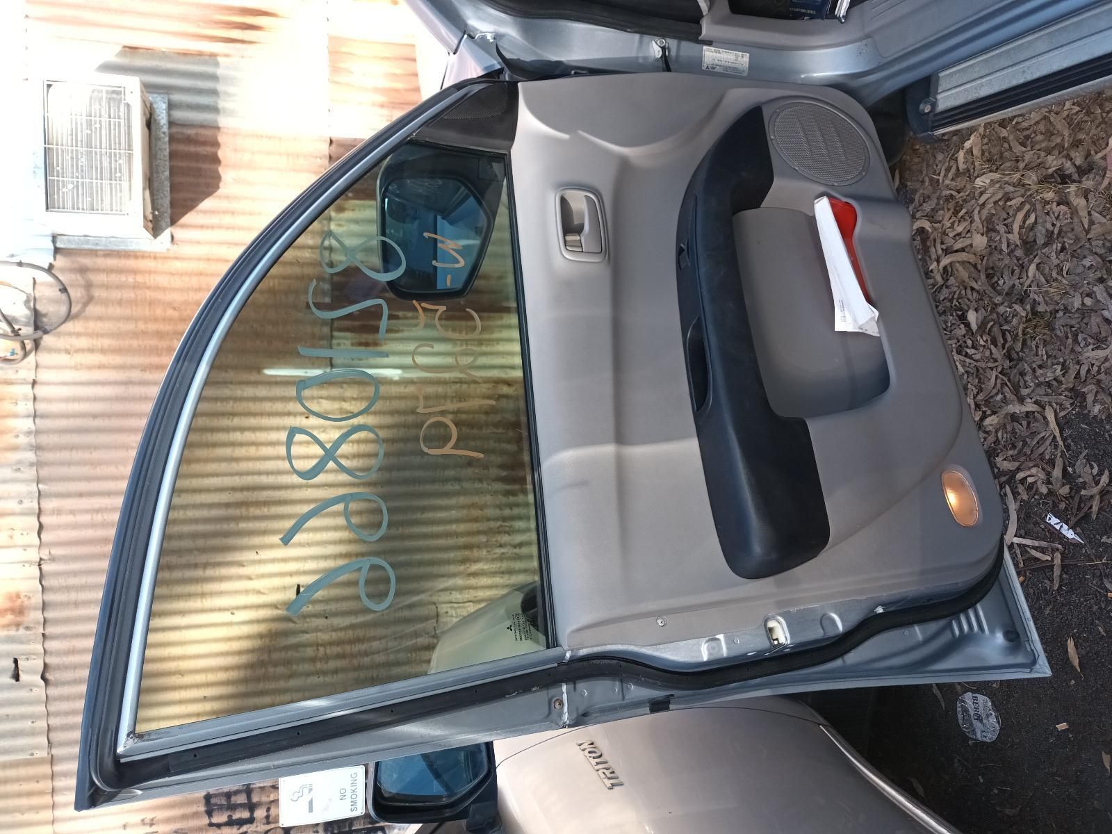 A Car with the Door Open — South West 4WD Wreckers in Harristown, QLD