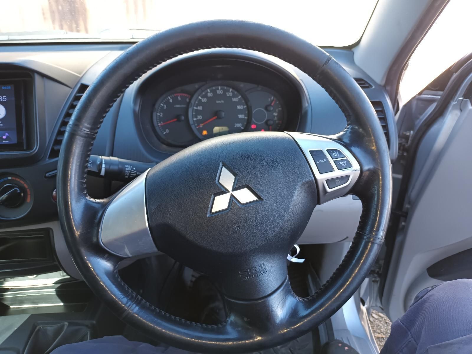 A Steering Wheel with a Mitsubishi Logo on It — South West 4WD Wreckers in Harristown, QLD