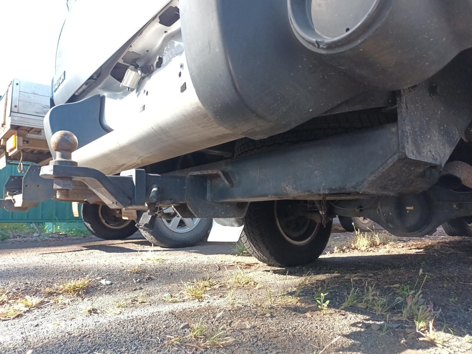 A Truck with a Trailer Attached to It is Parked on the Side of the Road — South West 4WD Wreckers in Harristown, QLD