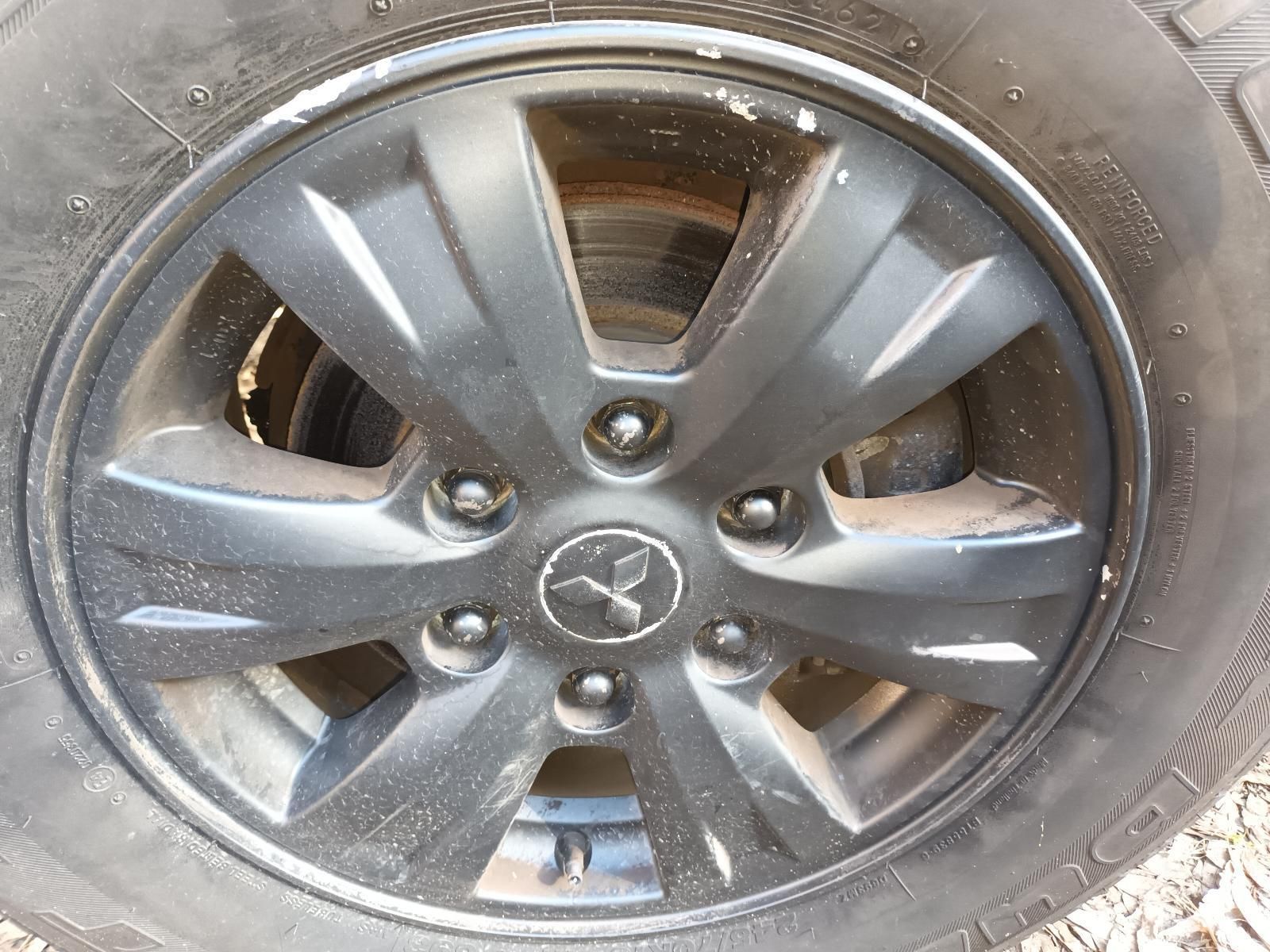 A Close Up of a Black Wheel on a Car — South West 4WD Wreckers in Harristown, QLD