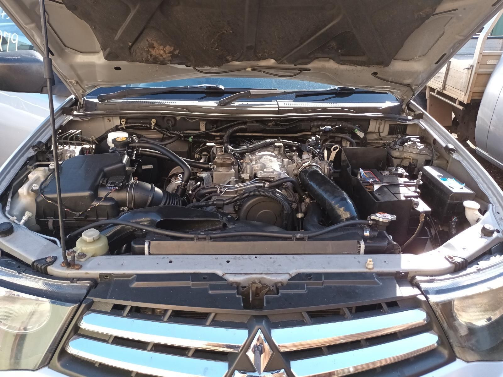 The Engine of a Mitsubishi Pajero with the Hood Open — South West 4WD Wreckers in Harristown, QLD