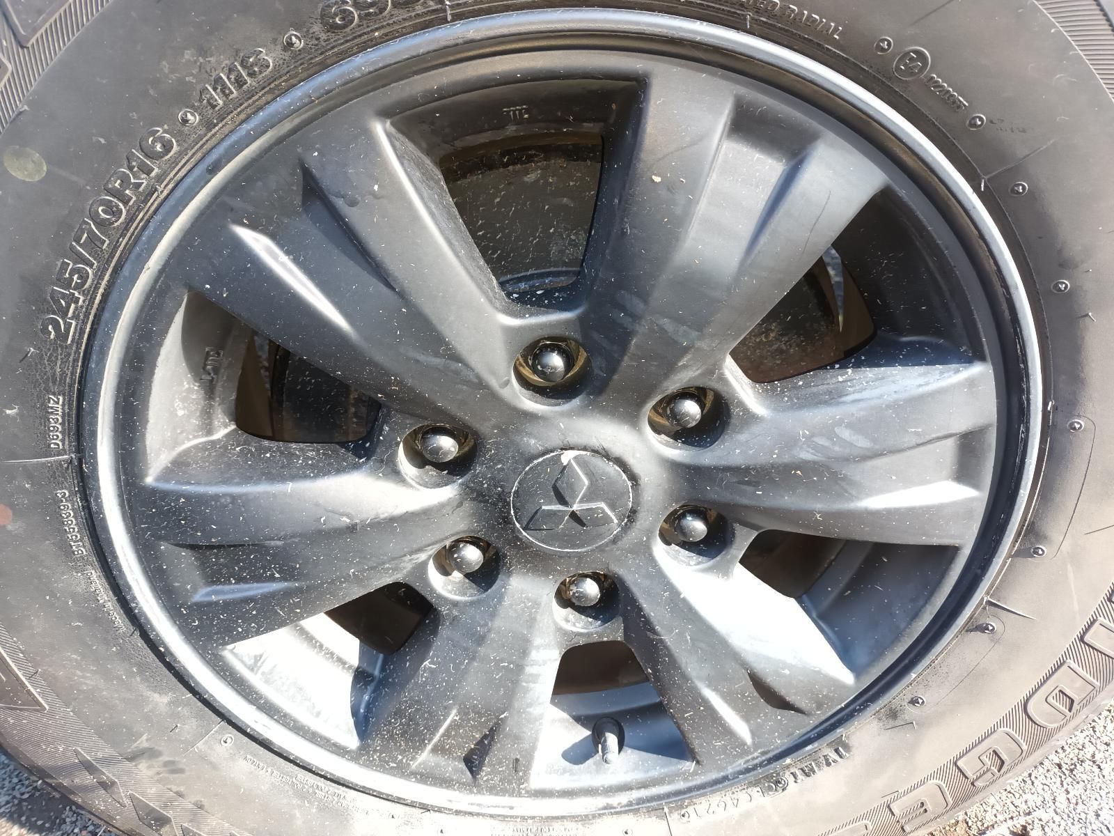 A Close Up of a Car Wheel with a Tire on It — South West 4WD Wreckers in Harristown, QLD