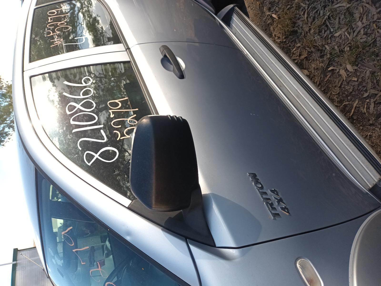 A Silver Car with the Numbers on the Side — South West 4WD Wreckers in Harristown, QLD