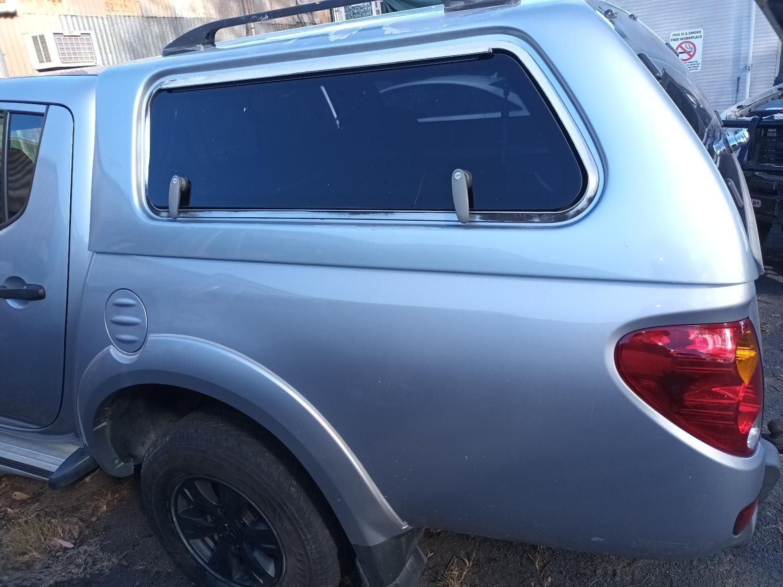A Silver Truck with a Canopy on Top of It — South West 4WD Wreckers in Harristown, QLD