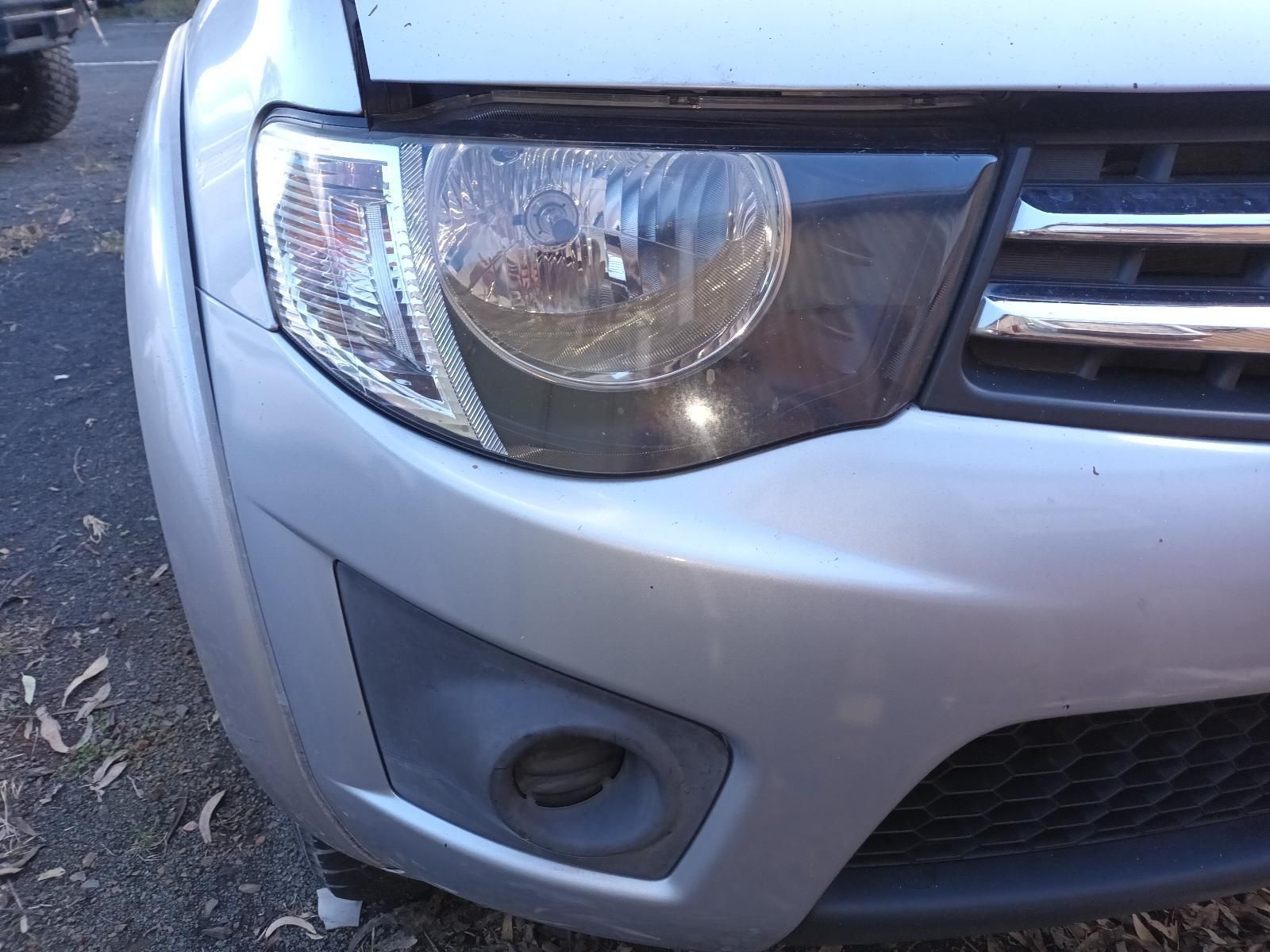 A Silver Car with the Hood Up is Parked on the Side of the Road — South West 4WD Wreckers in Harristown, QLD