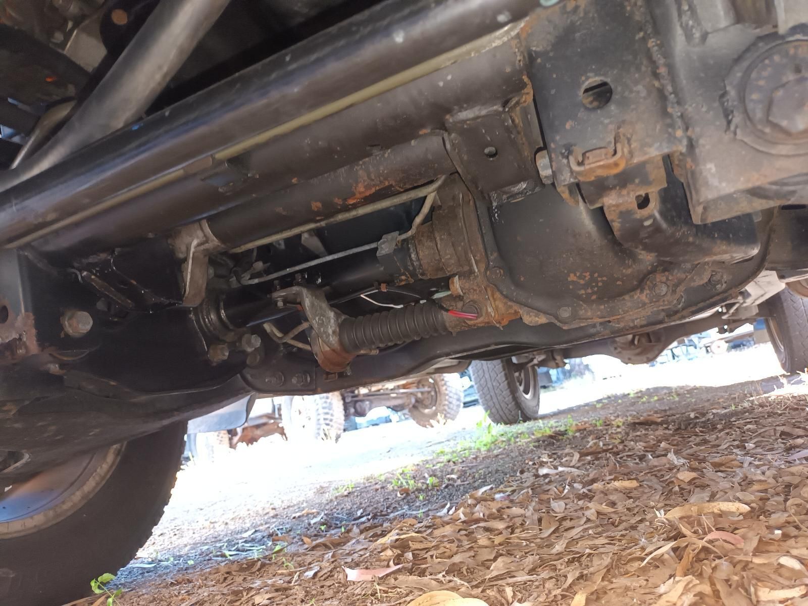 A Close Up of the Underside of a Car on a Dirt Road — South West 4WD Wreckers in Harristown, QLD