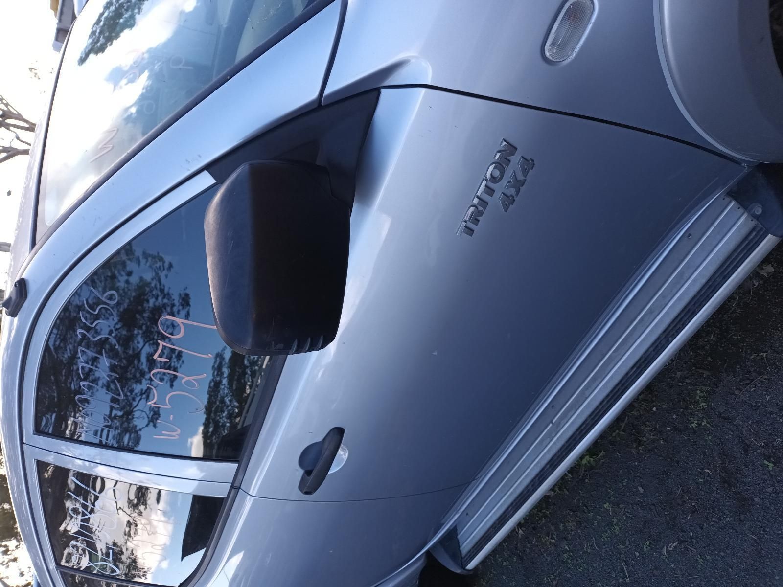 A Silver Car is Parked on the Side of the Road — South West 4WD Wreckers in Harristown, QLD