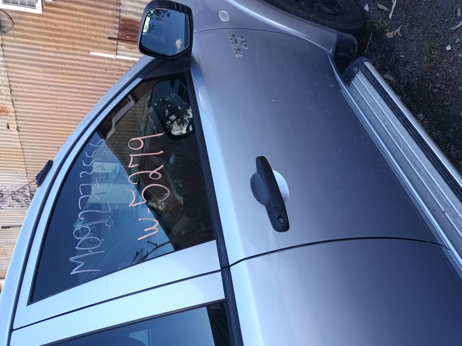A Silver Car is Parked in Front of a Building — South West 4WD Wreckers in Harristown, QLD