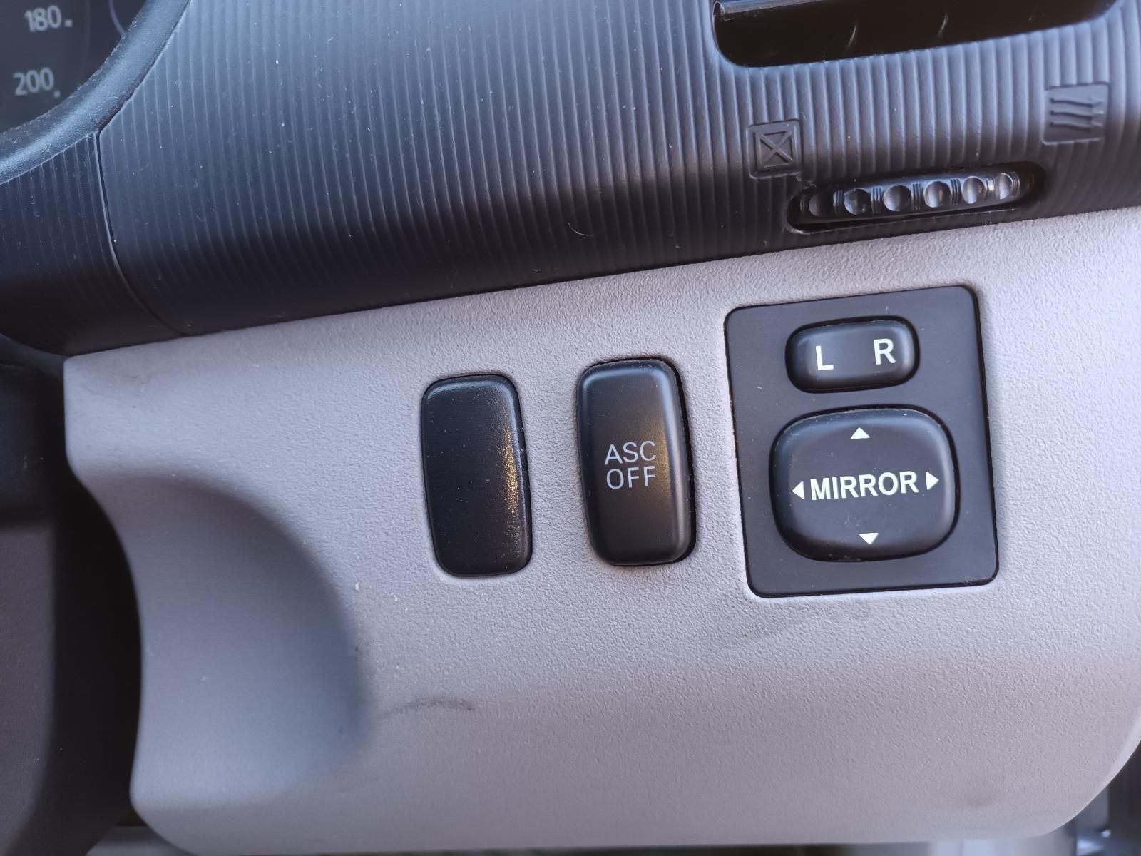 A Close Up of a Car Dashboard with a Mirror Switch — South West 4WD Wreckers in Harristown, QLD