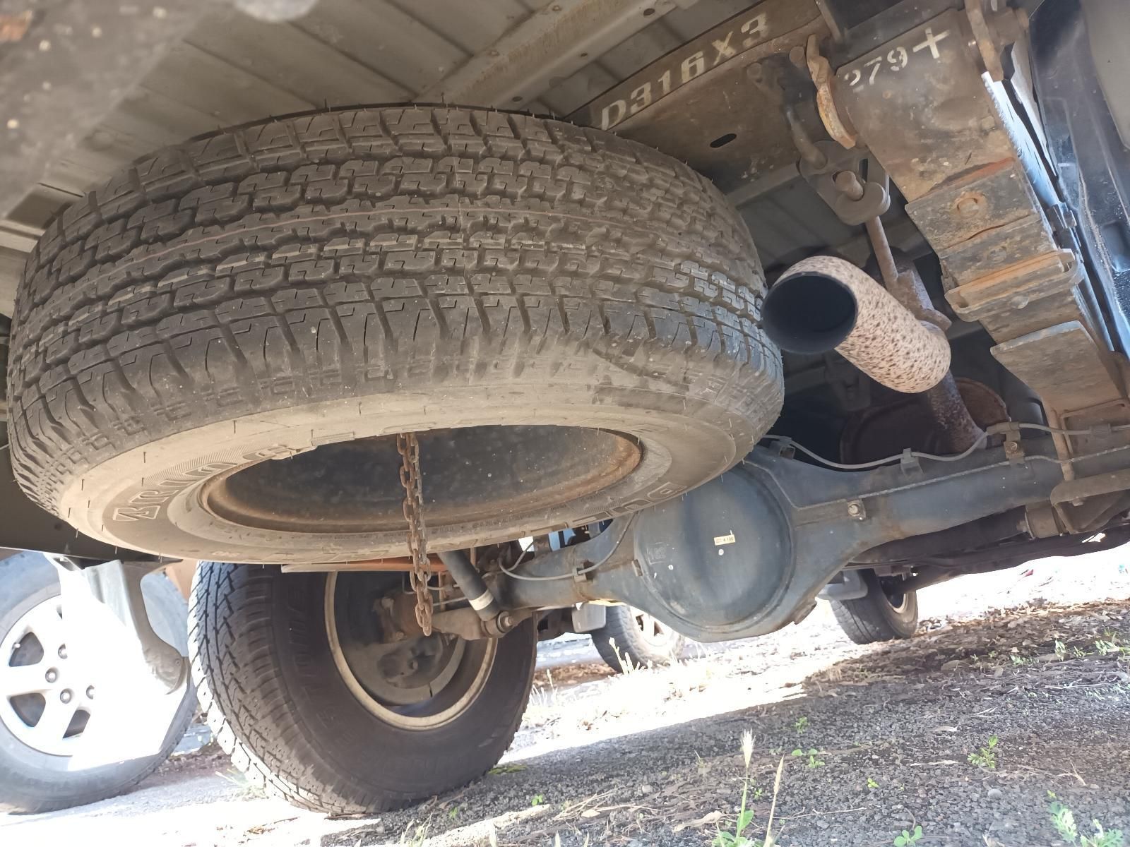 A Tire is Hanging from the Back of a Truck — South West 4WD Wreckers in Harristown, QLD