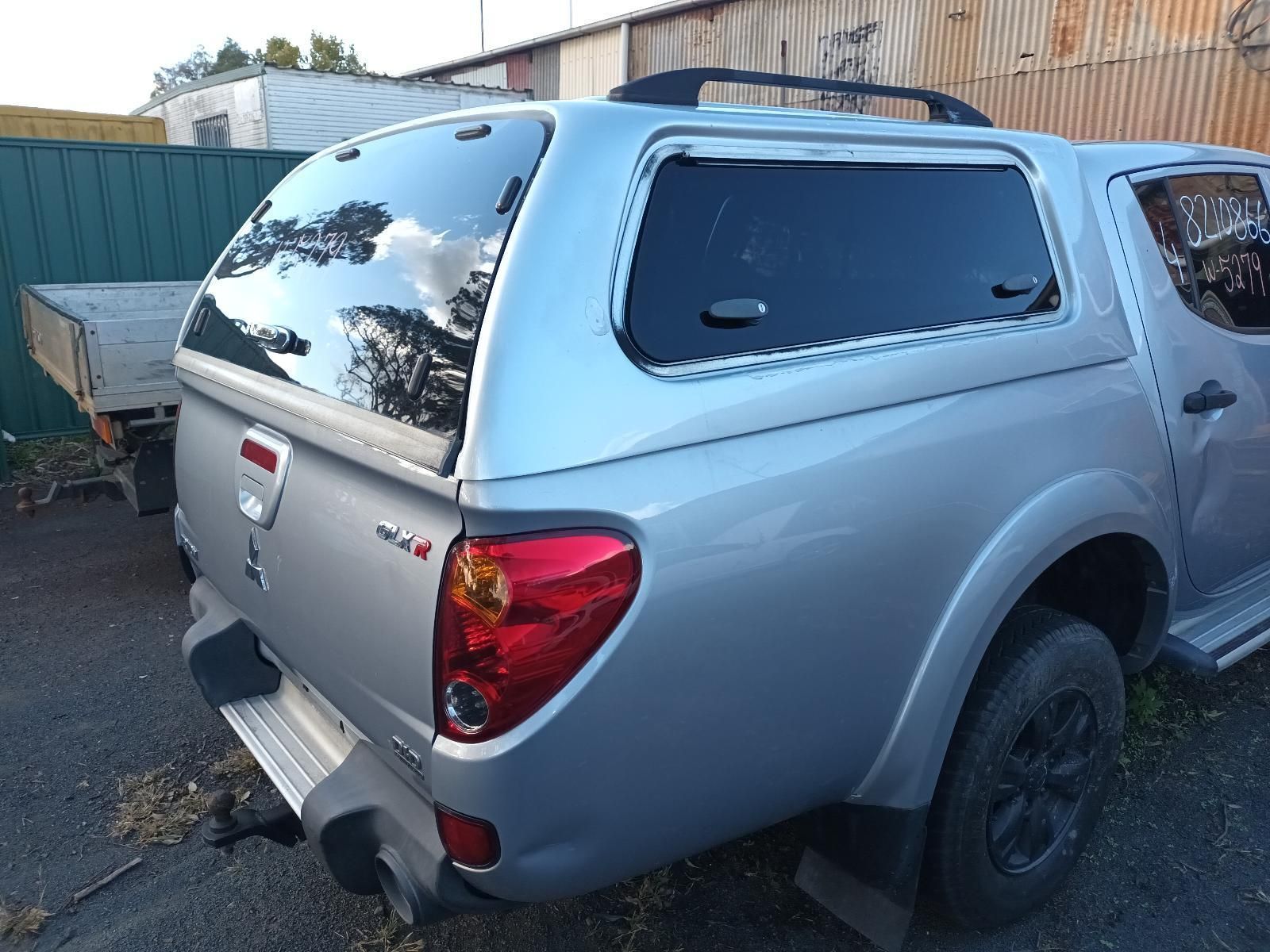 A Silver Truck with a Canopy on Top of It — South West 4WD Wreckers in Harristown, QLD